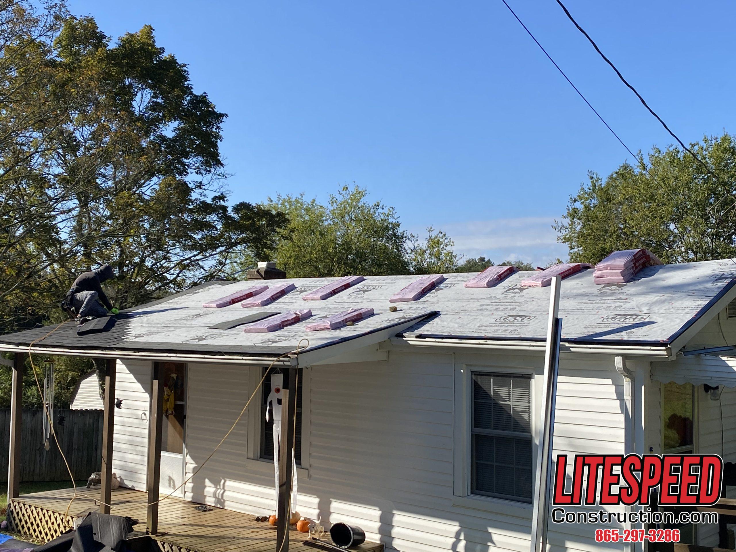 THis is a picture of a new roof being installed with shingles at the top of the roof