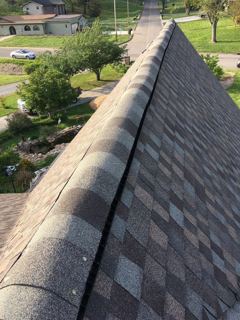 This is a view of the ridge of the roof with ridge cap shingles.