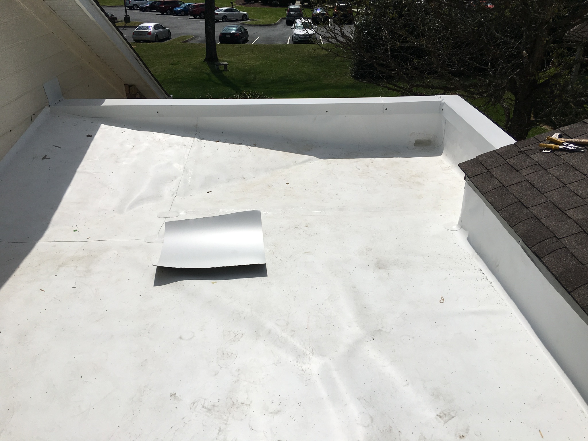 This is a view of flat roof with white TPO membrane roof.