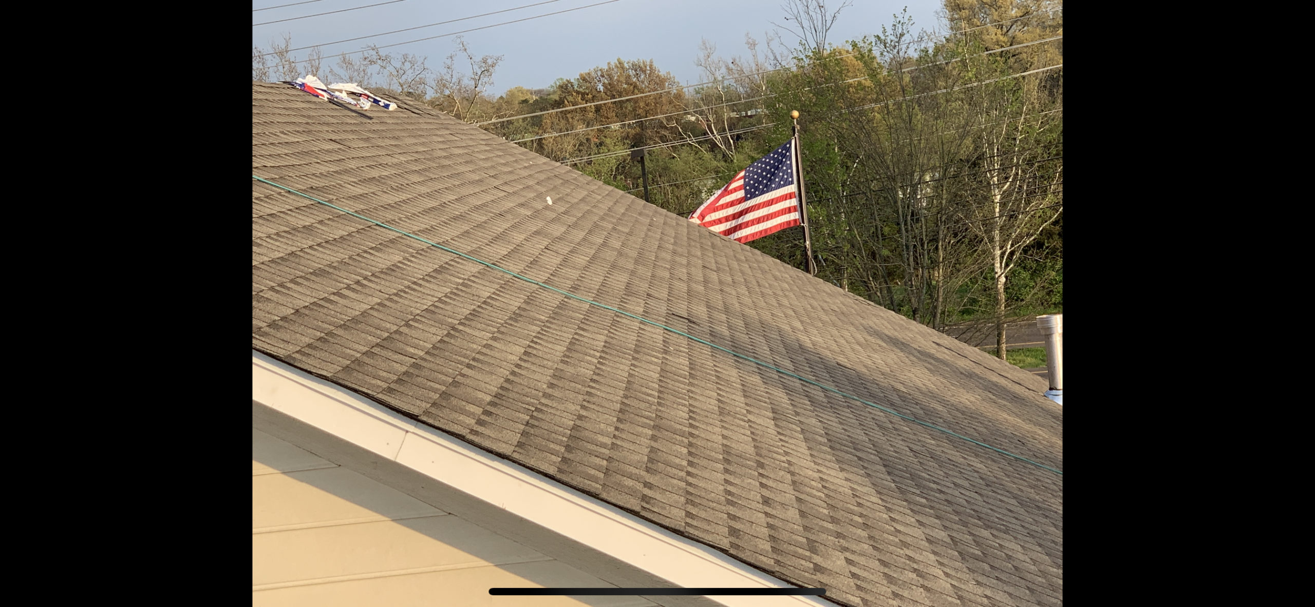 This a view of brown shingles on the roof. 