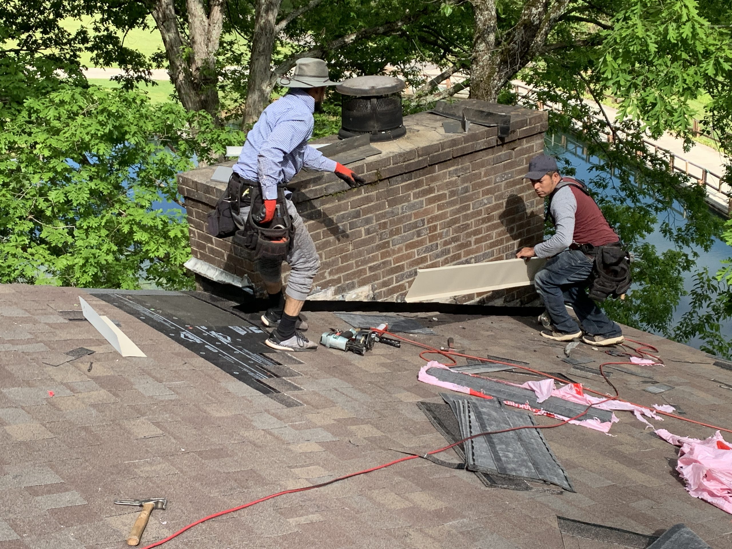 This picture is showing flashing being installed on a chimney.