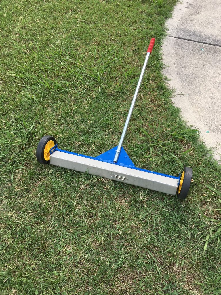 This is a magnet roller that is used to pick up nails from the grass and driveway.