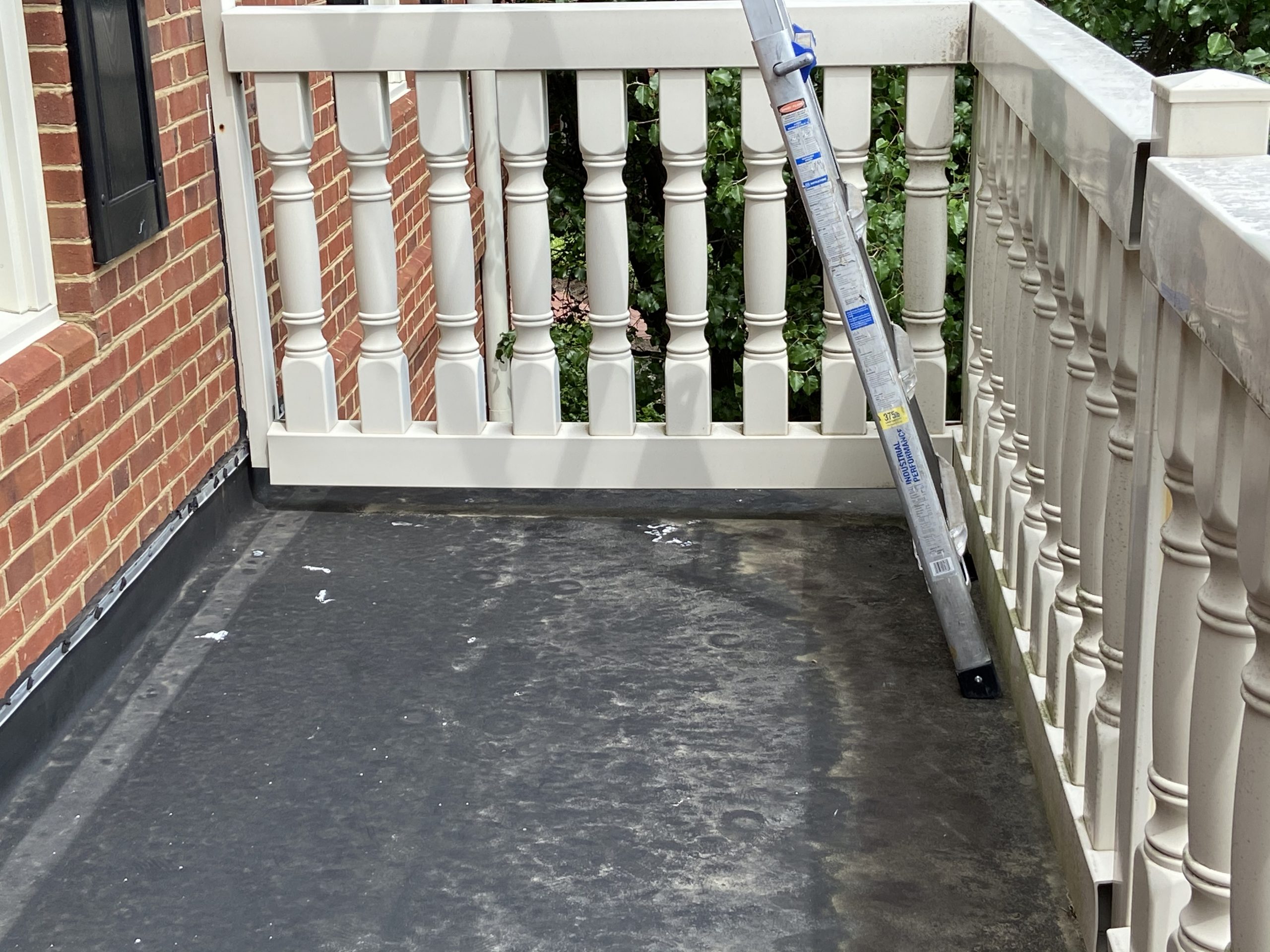 This is an image of white vinyl railing on a balcony.
