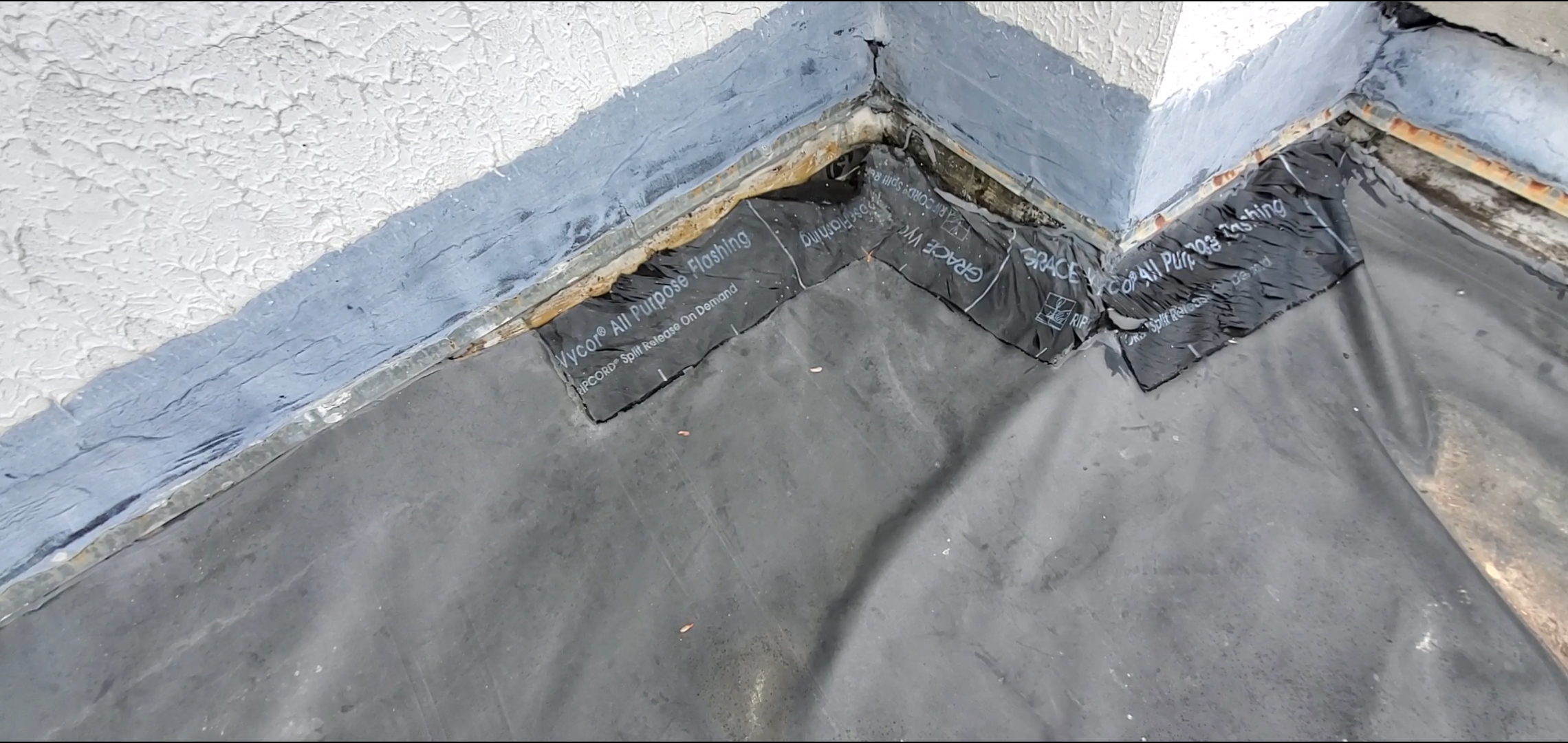 This is a picture of black EPDM pulling away from the wall.