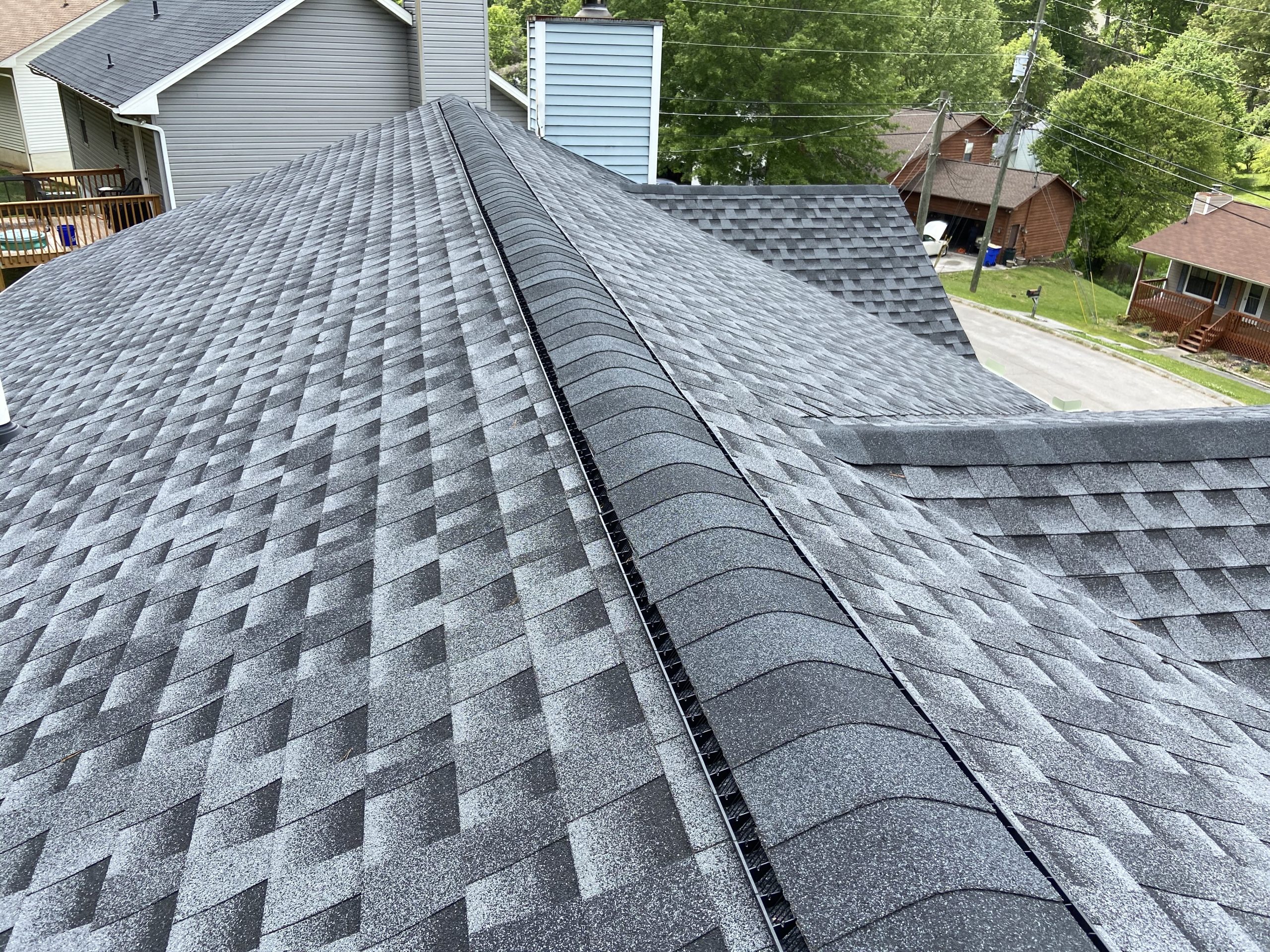 This is a view of the ridge of the roof with ridge cap shingles. 