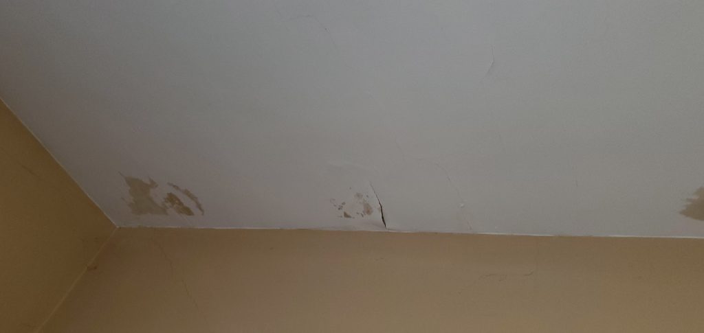 this is another picture of more roof leaks on the ceiling of a home