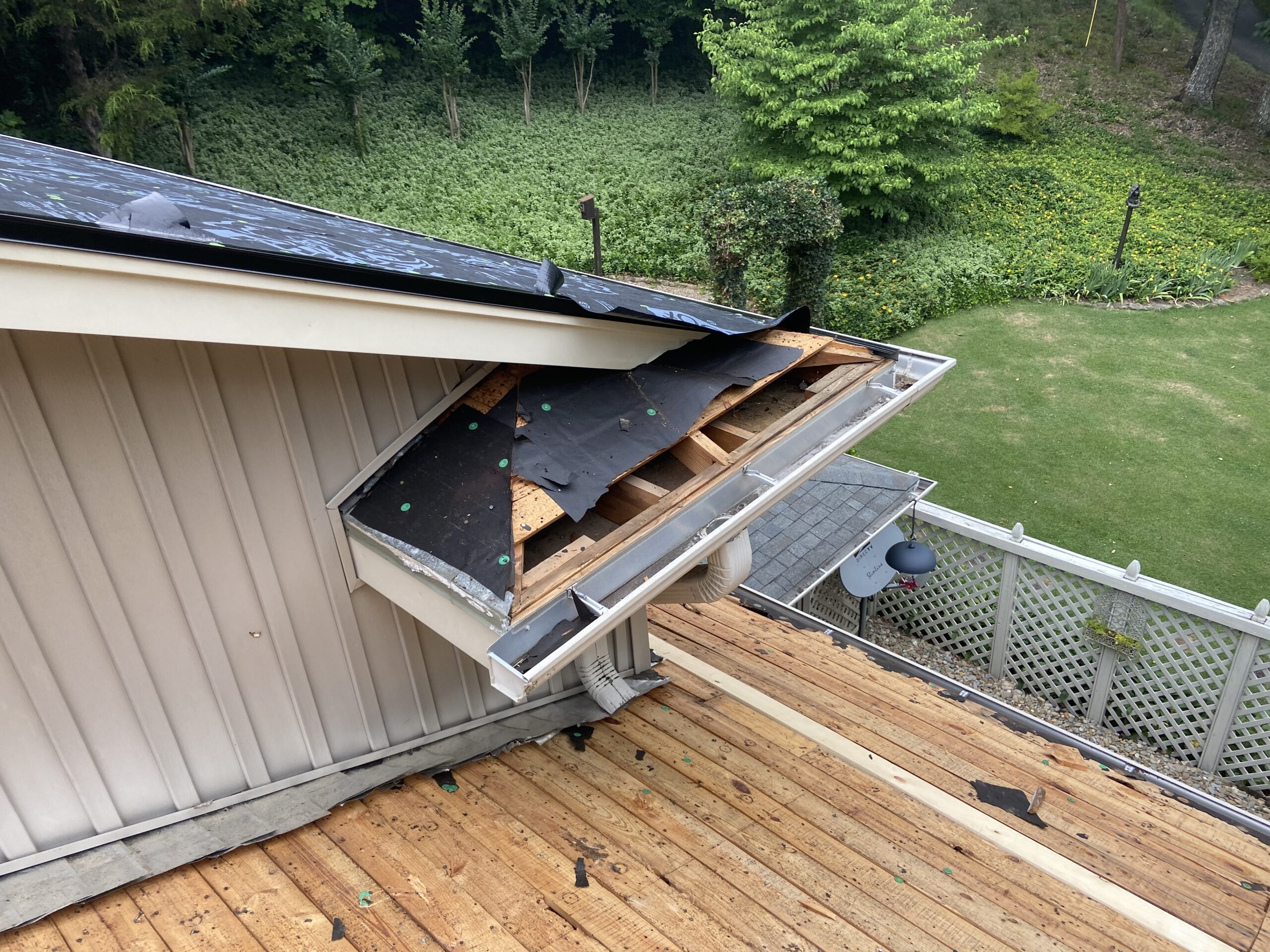 This is a picture of the deck boards  and deck boards at the eave of the roof that needs to be replaced.