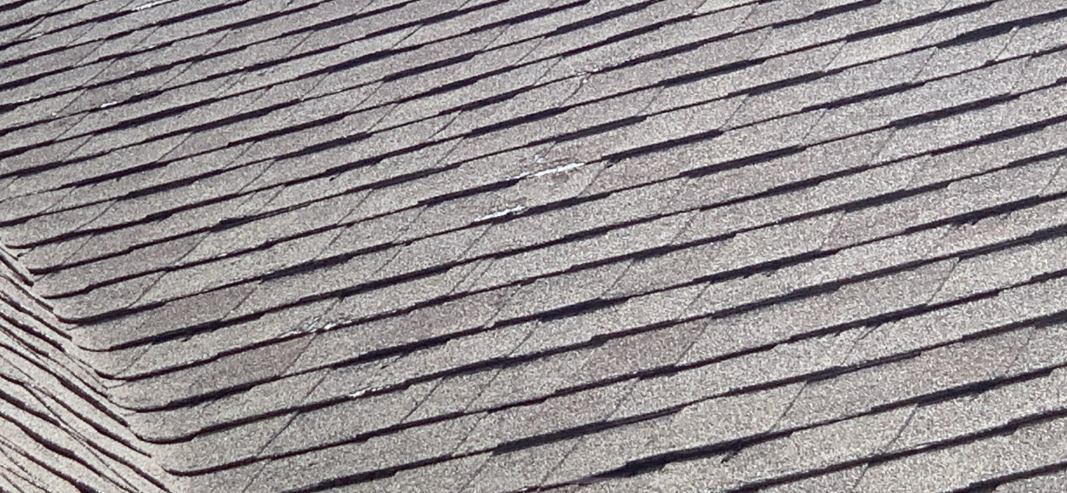 Hail damage on architectural dimensional shingles