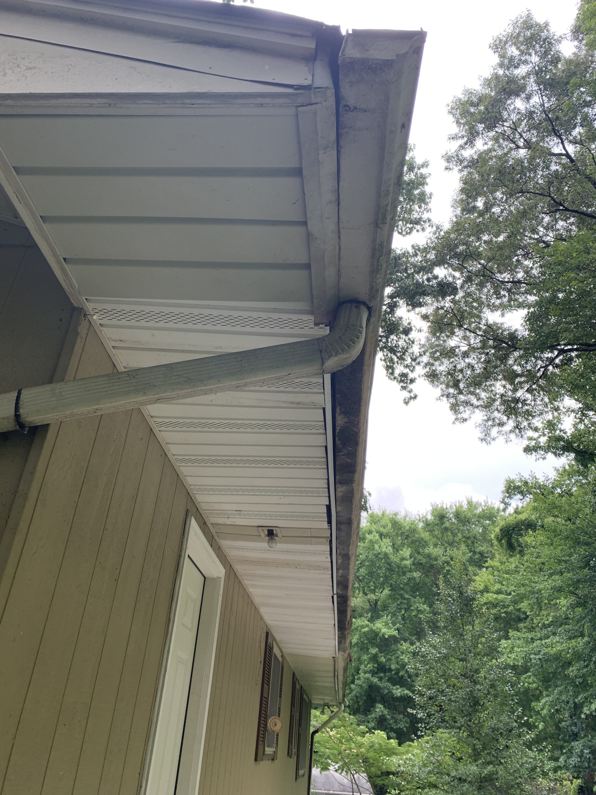 this is a picture of a failing gutter on this home