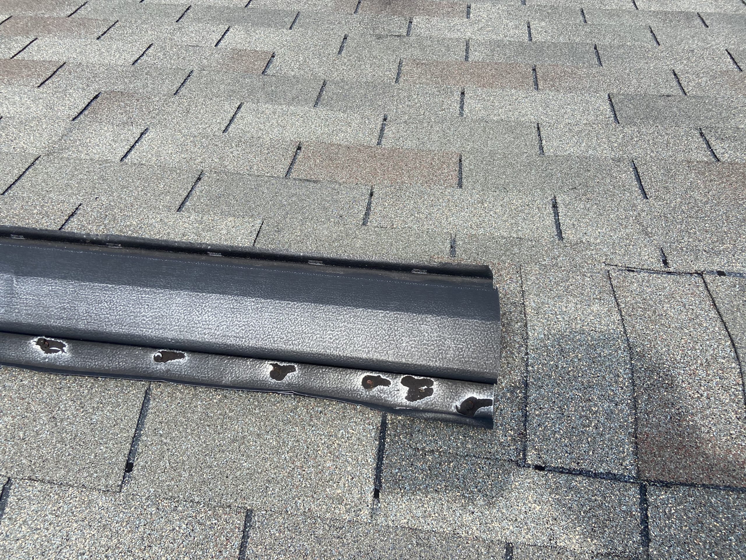 this is a picture of an old metal ridge vent on a roof, these ridge vents have bad problem with causing roof leaks