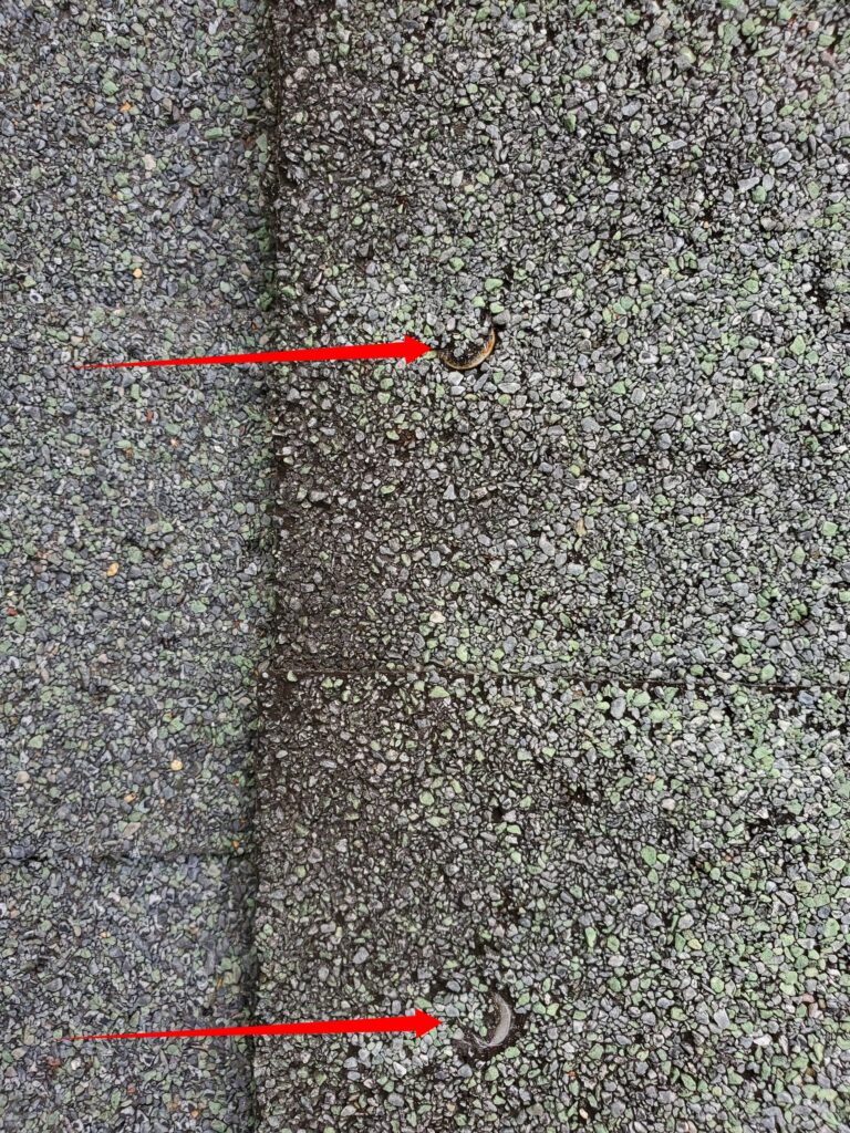 This is a picture of the nail puling out of the shingle 