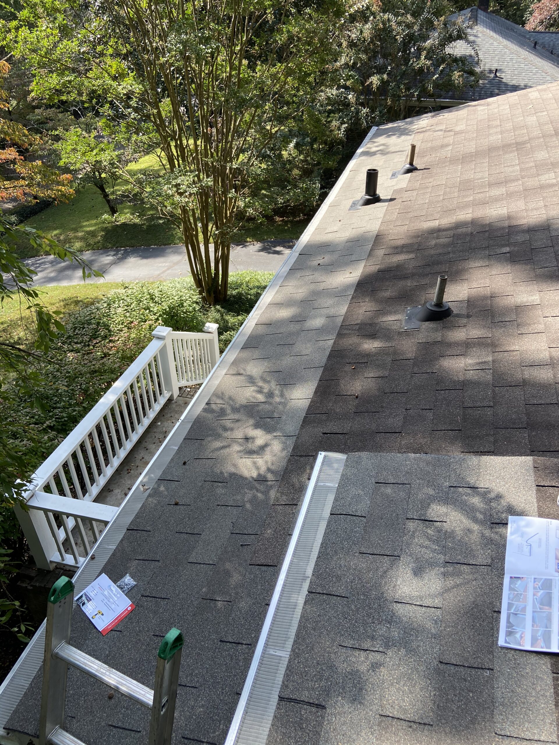 This picture showing repairs the edge of a roof the roof color is gray