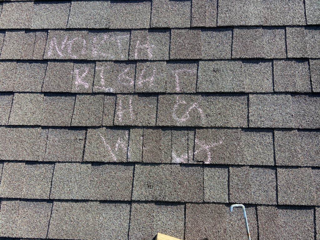 Chalk marks from farm bureau adjuster on a roof Litespeed