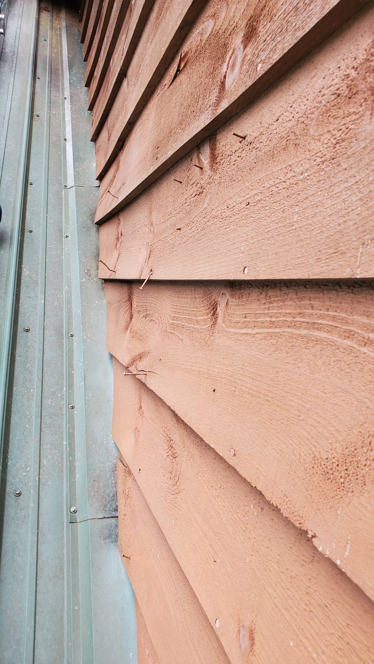 This is a picture of a the wood siding of the house. 