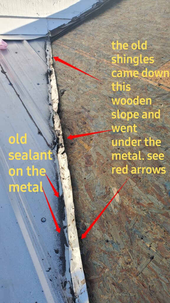 This is a picture of a wooden roof butting up against a metal roof and there are red arrows on the picture pointing to things and yellow words as well 