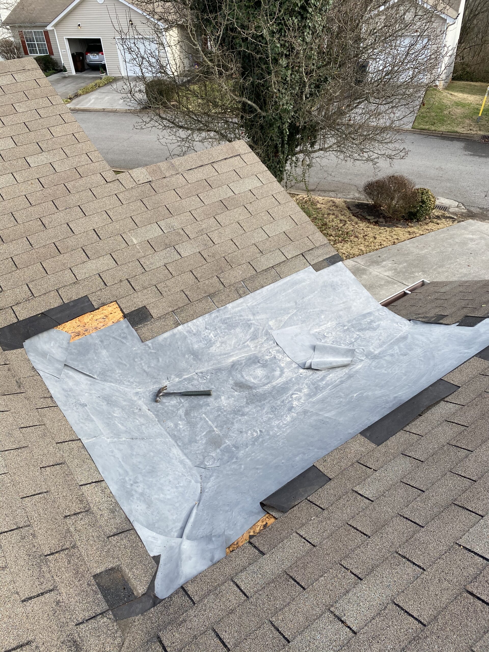 This is a picture of a membrane being laid down instead of shingles for better drainage.