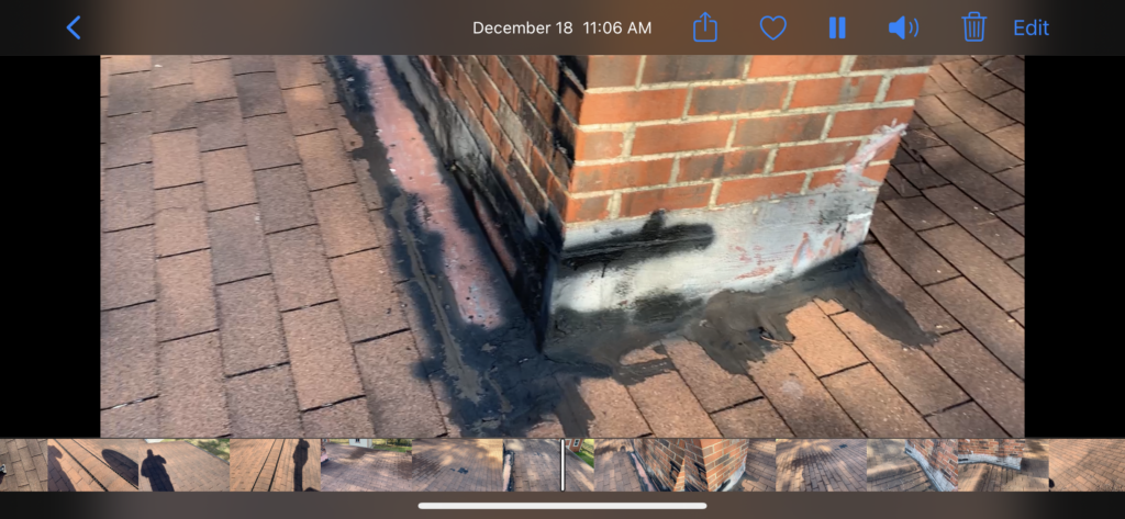 Repairs have been attempted around the chimney flashing on this low slope roof in Knoxville Tennessee