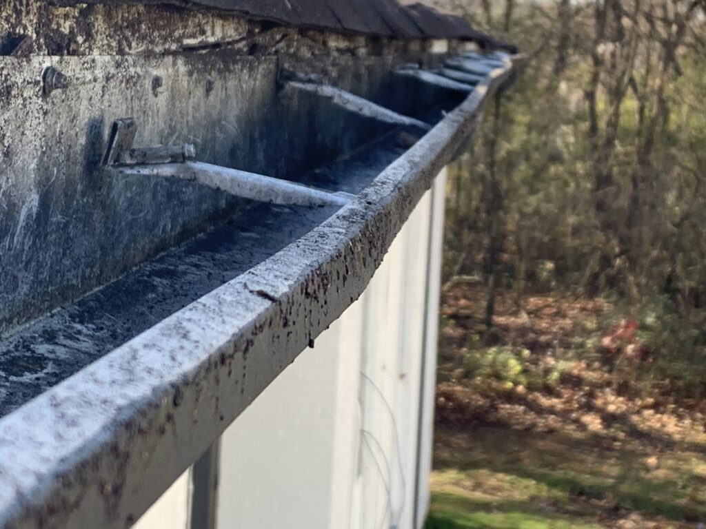  Broken facia boards in the gutter is pulling away from the structure causing the gutters to sag and water to run down onto the soffits