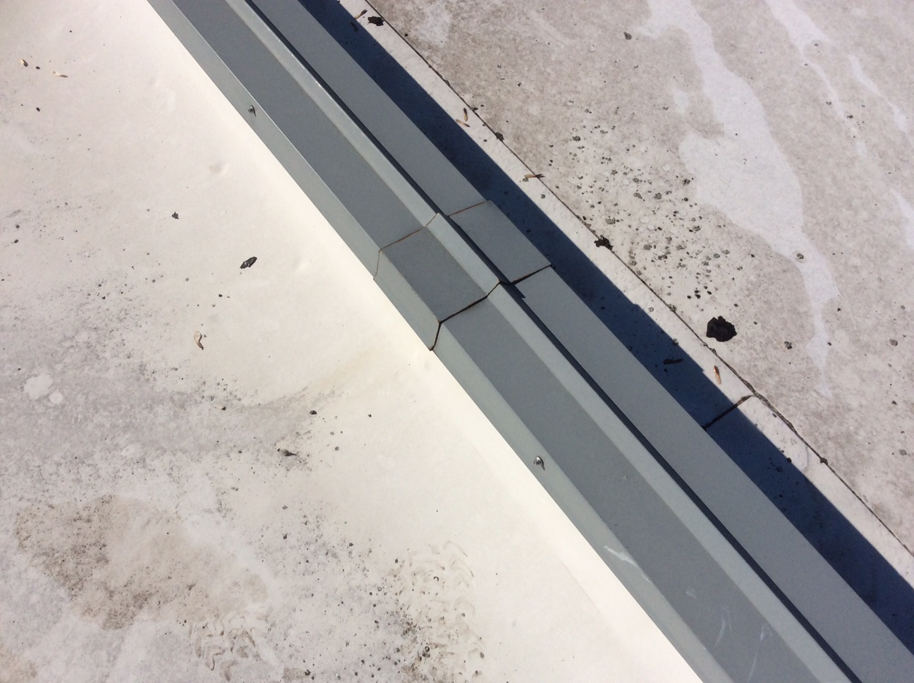 This is a view of edge metal on a white commercial roof.
