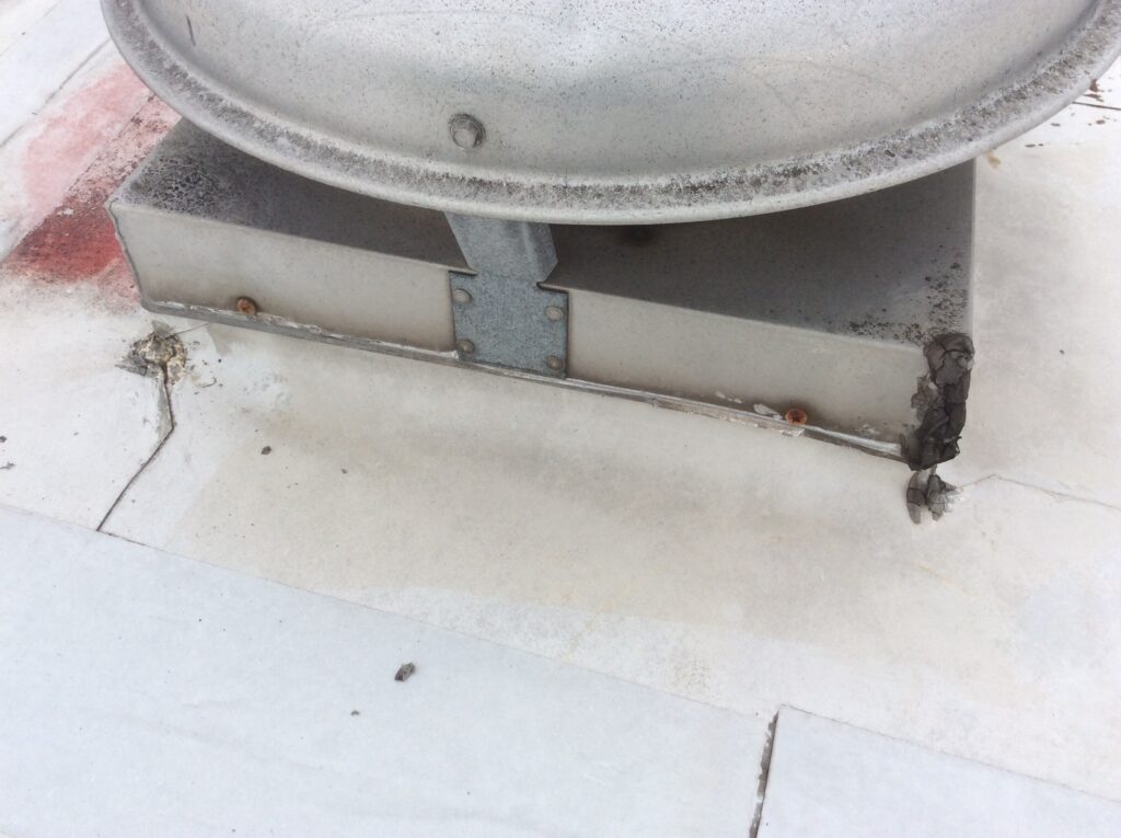 This is a view of a vent on a flat TPO commercial roof. 
