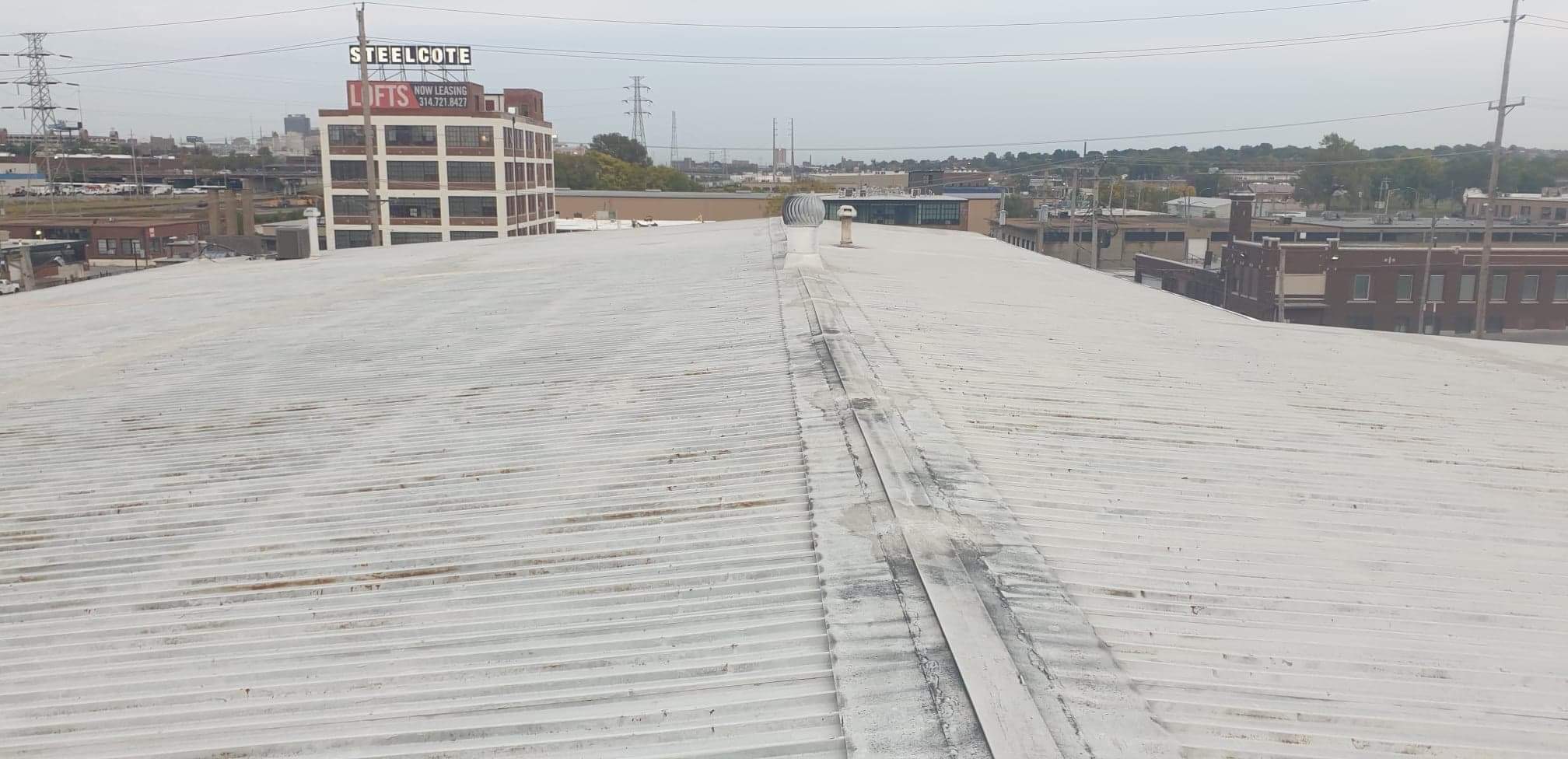 This is a picture of a metal roofing deck that has roof coating that’s about to go on