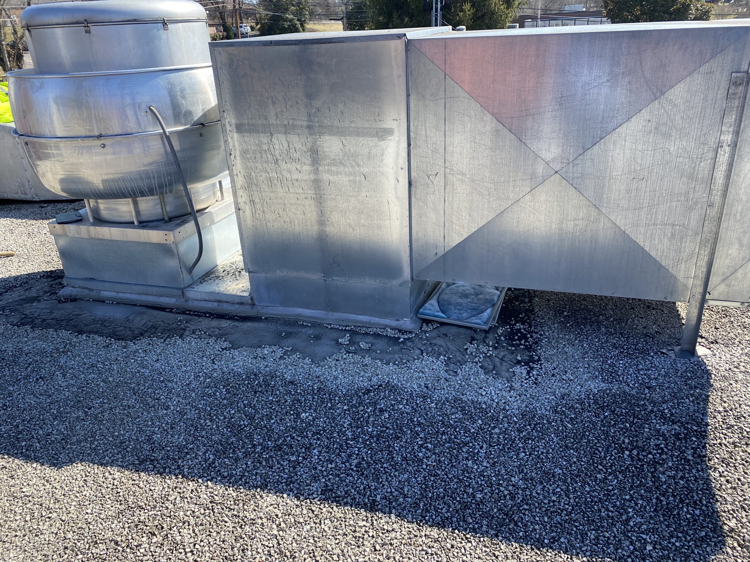 This is a picture of an hvac unit on top of a commercial flat roof