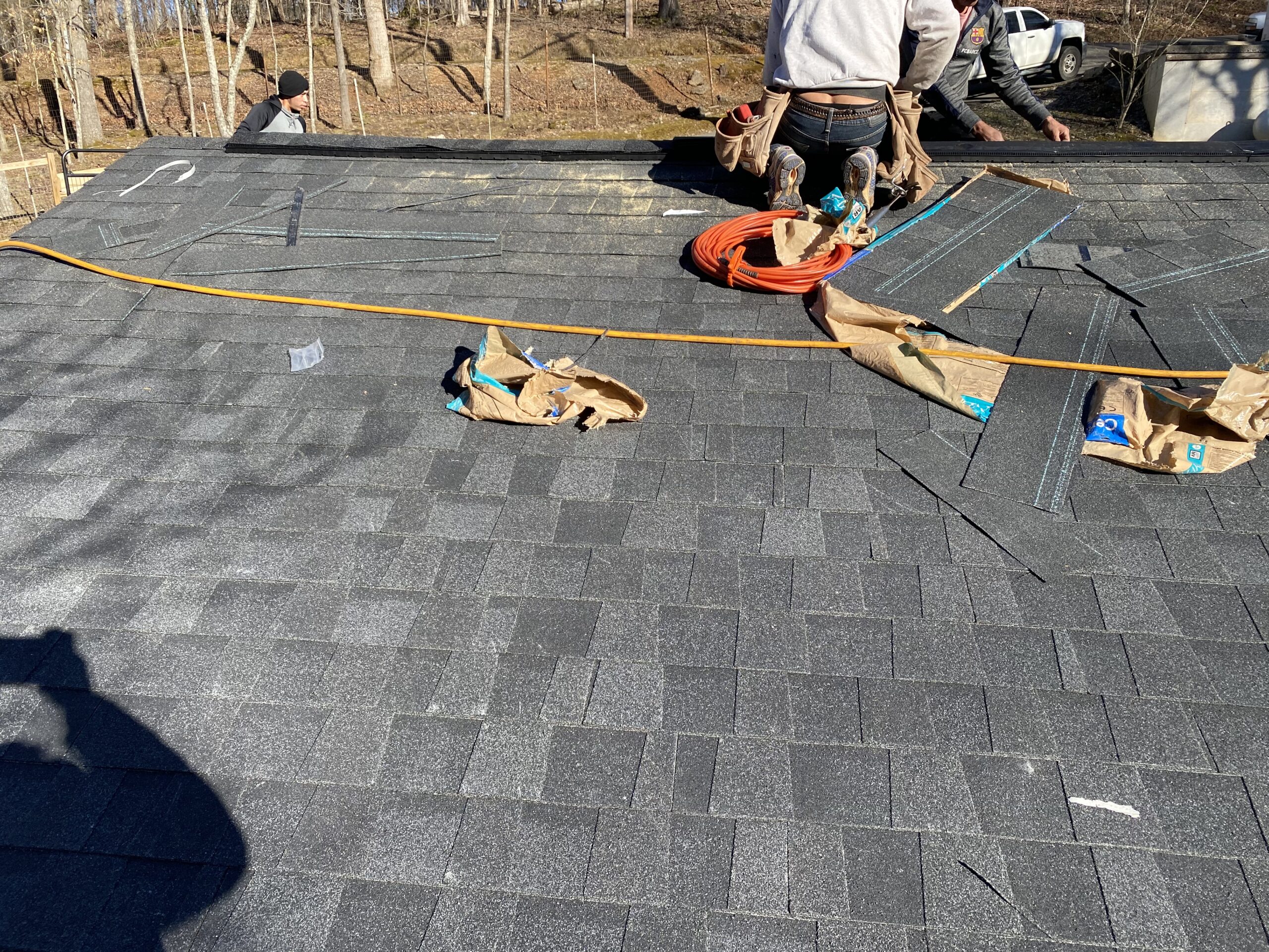 This is a picture of a charcoal black shingle on a roof installation