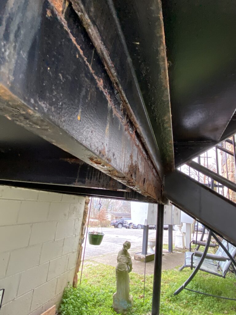 There is some rust at some of the steel stairwells that are being inspected 