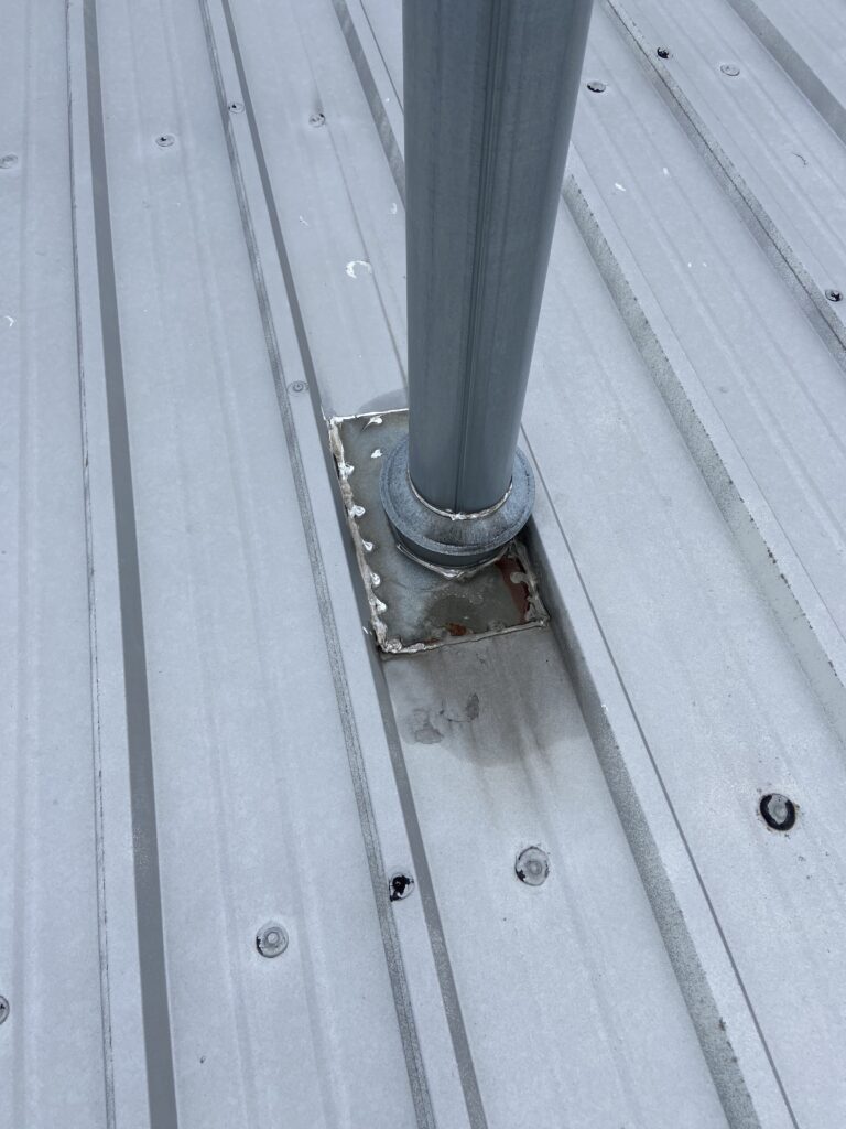 This is a pipe boot on a commercial metal roof