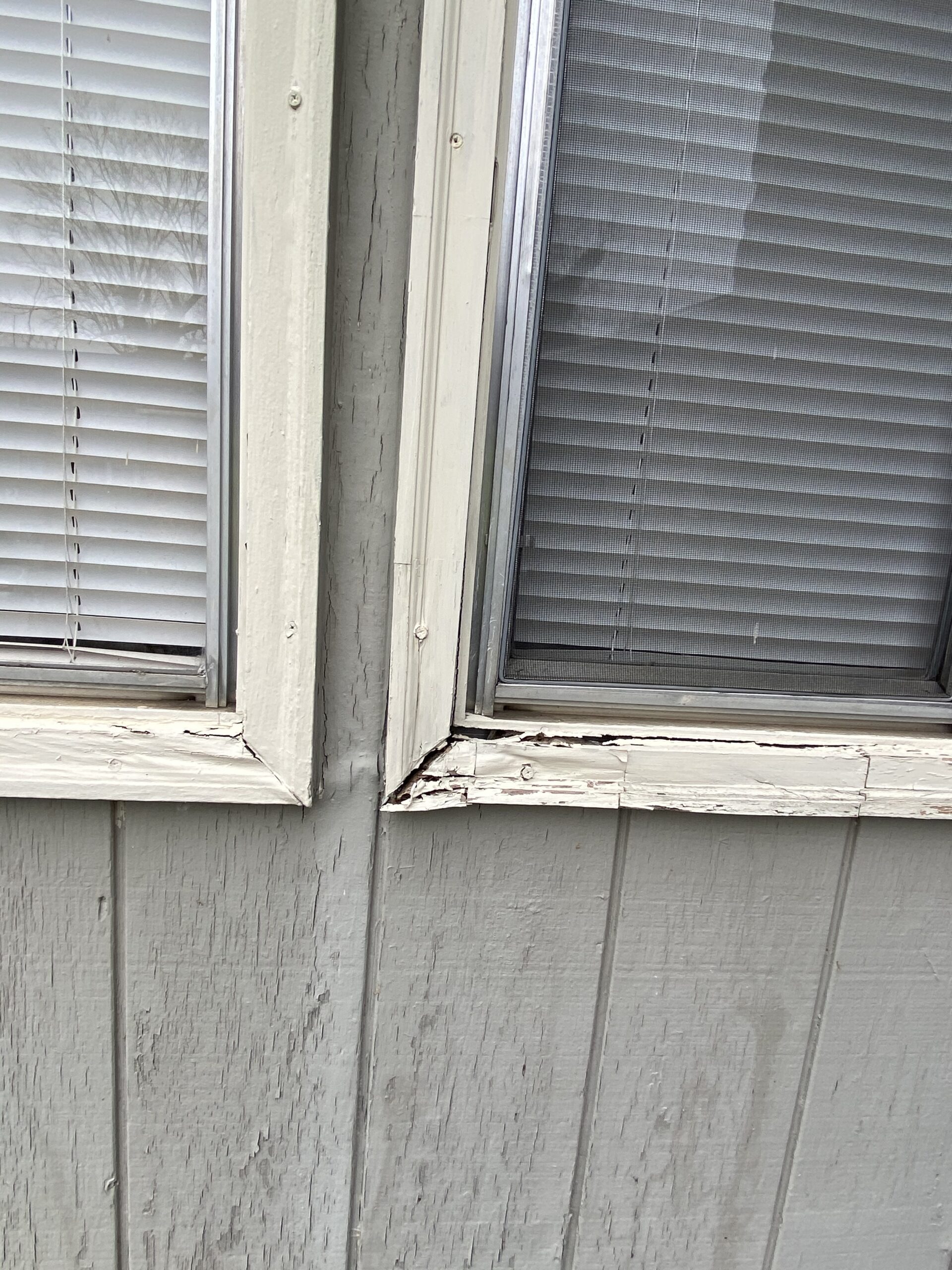 This is a picture of a window with some rotten trim boards in Knoxville Tennessee