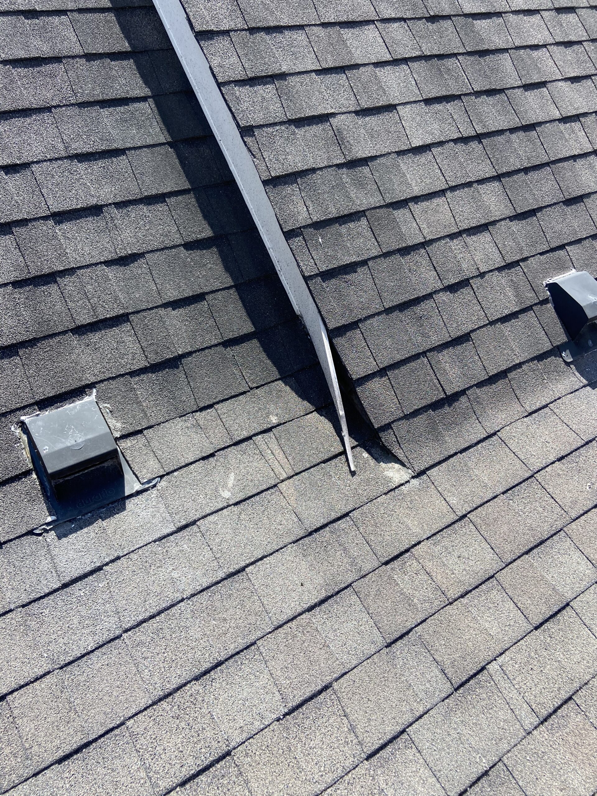 This is a picture of a brown shingle that has roof leaks