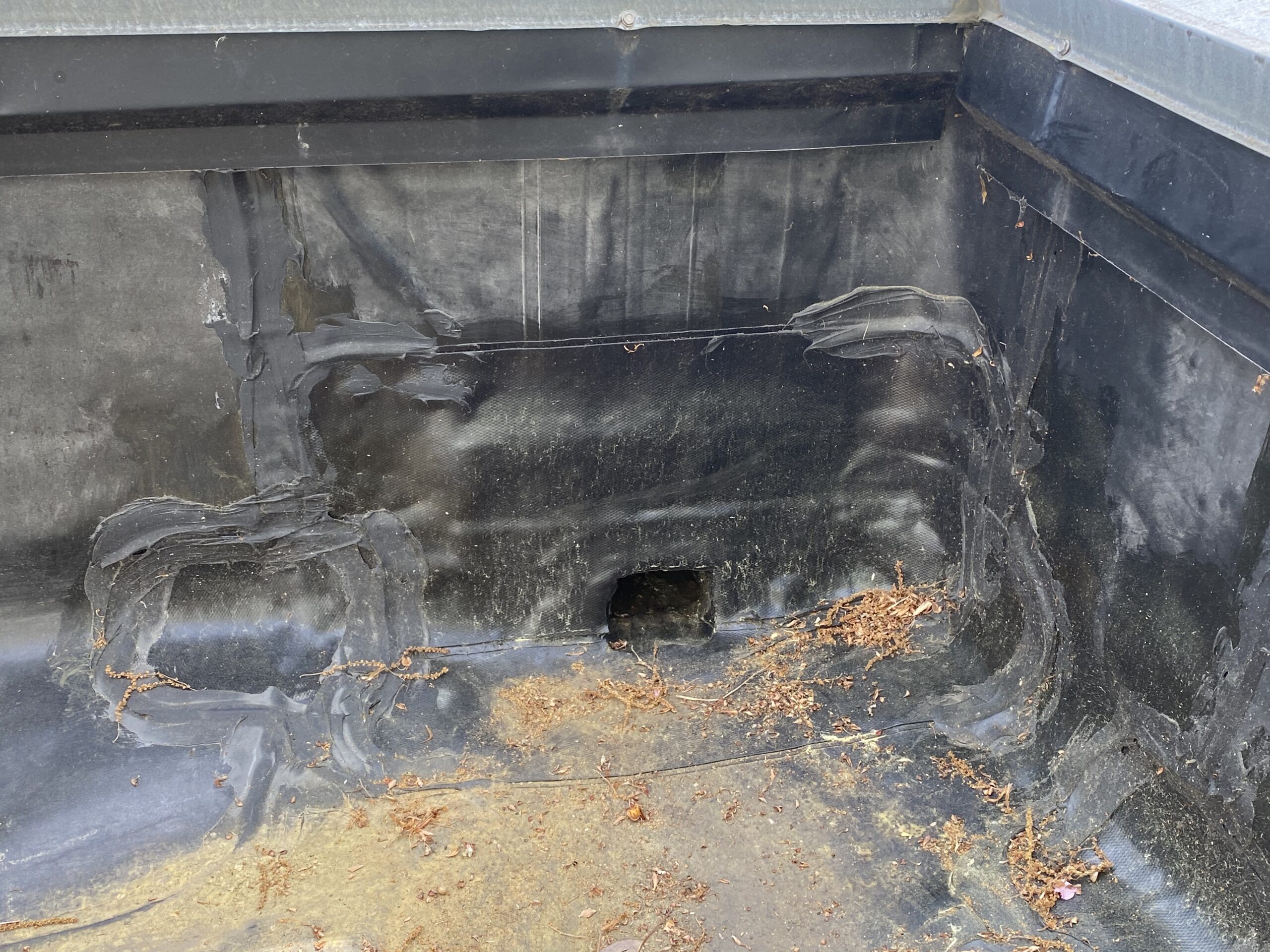 This is a picture of the drainage system on a black EPDM roof