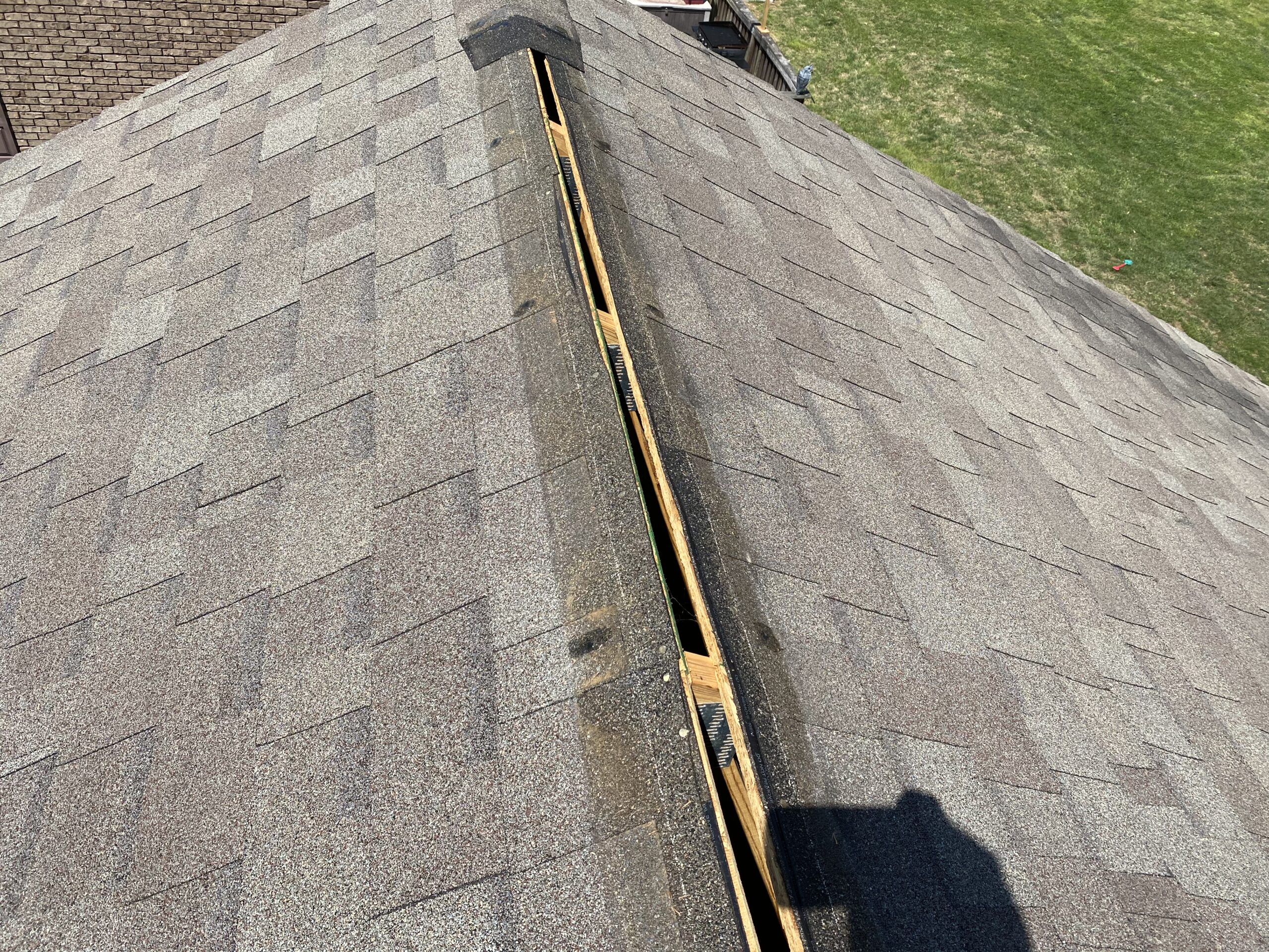 This is a picture of an open ridge with weather wood shingles