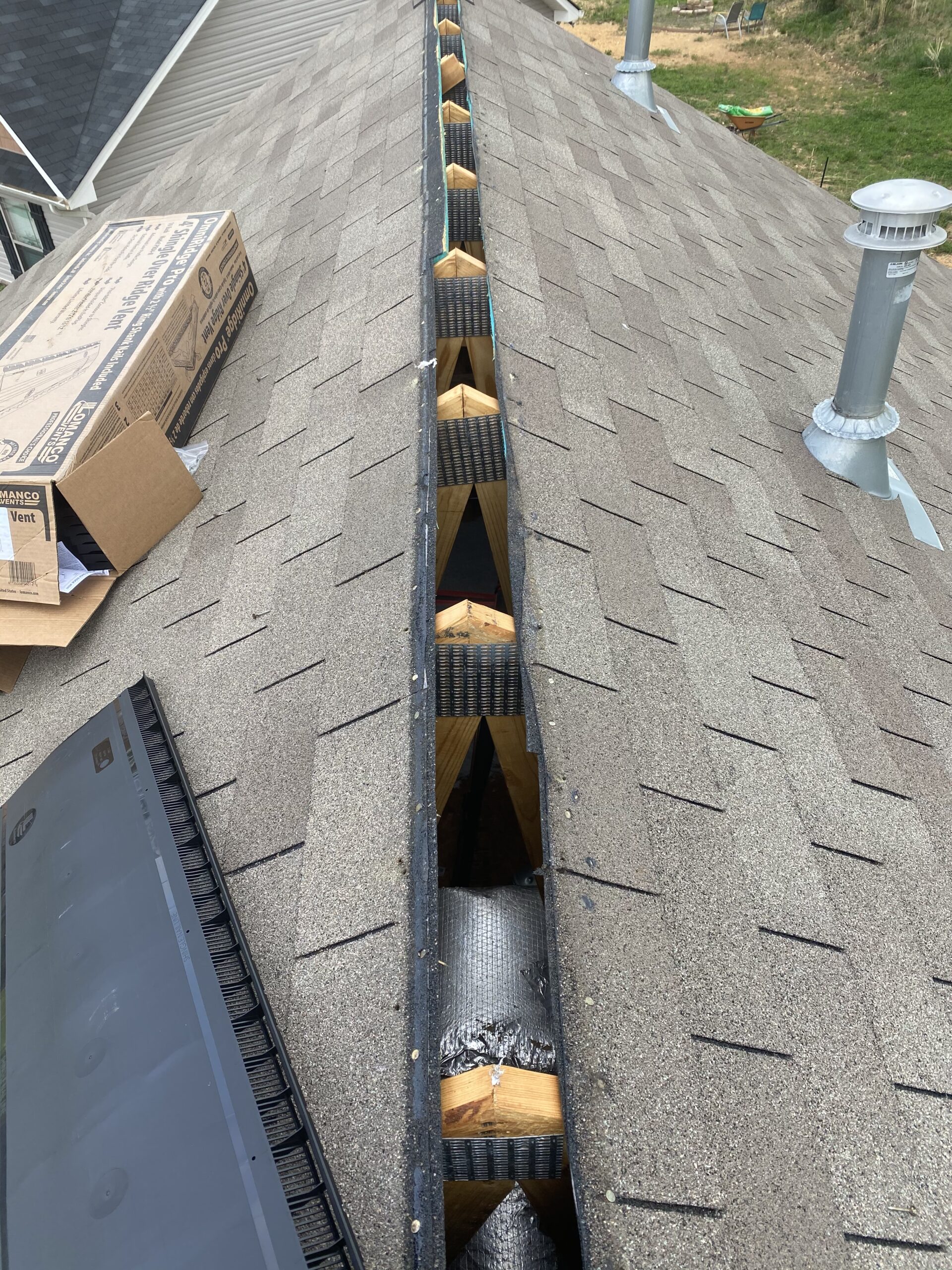 This is a picture of a ridge of the roof without a vent on it