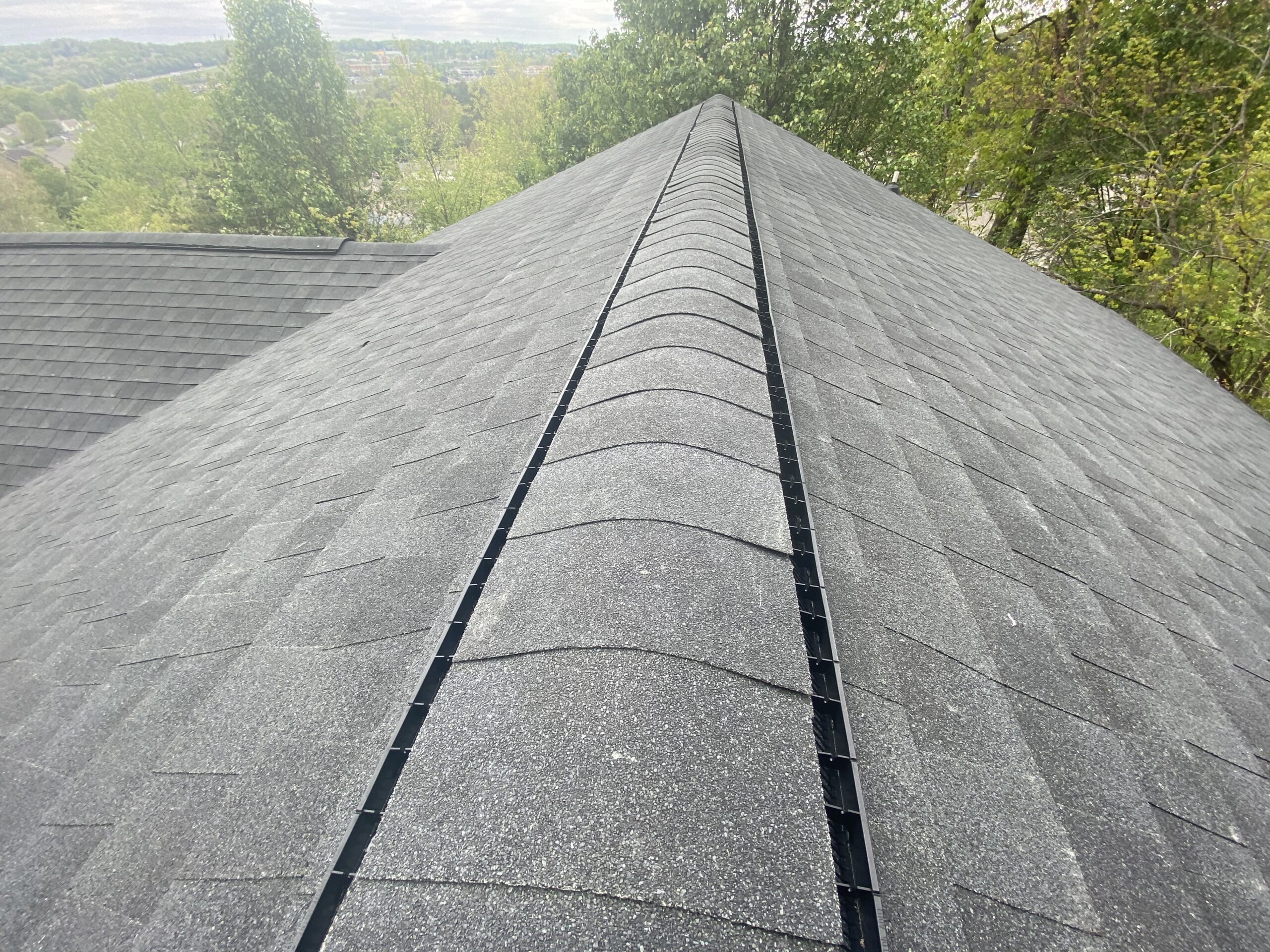 This is a picture of a ridge vent with ridge cap shingles