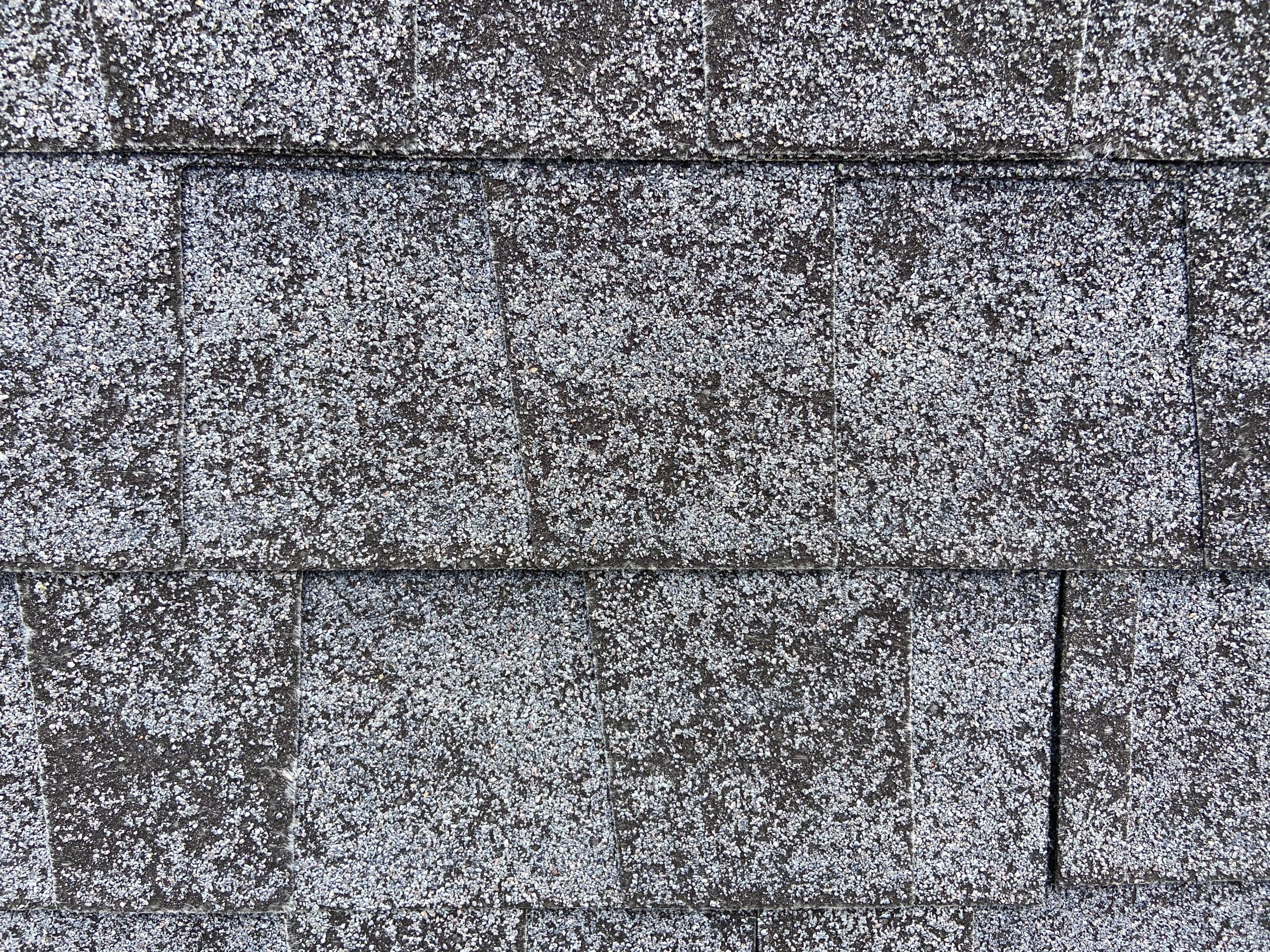 This is a picture of dimensional shingles are in bad shape and show approximately 80 to 90% granular loss.