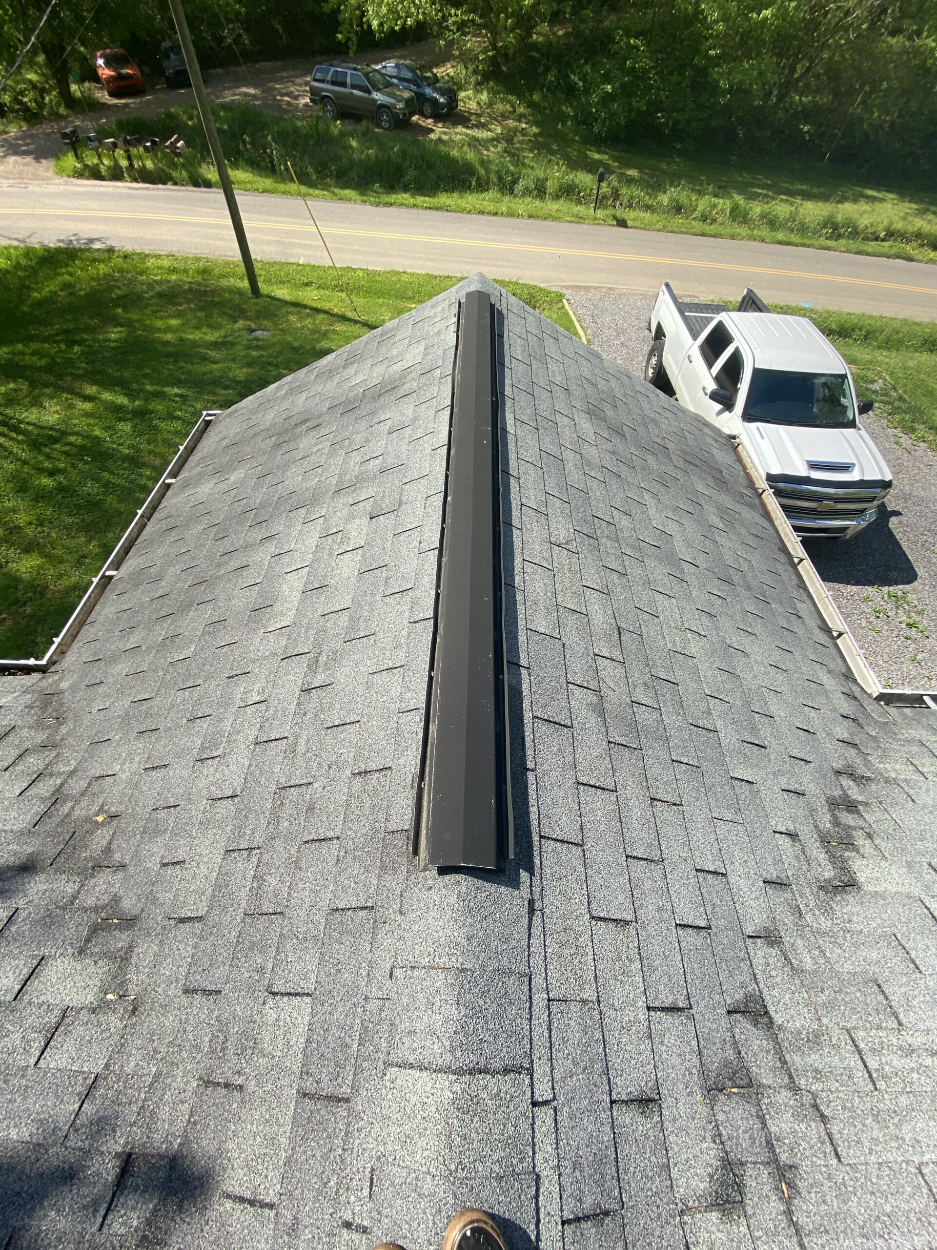 This is a picture of and old metal ridge vent on a three tab roof