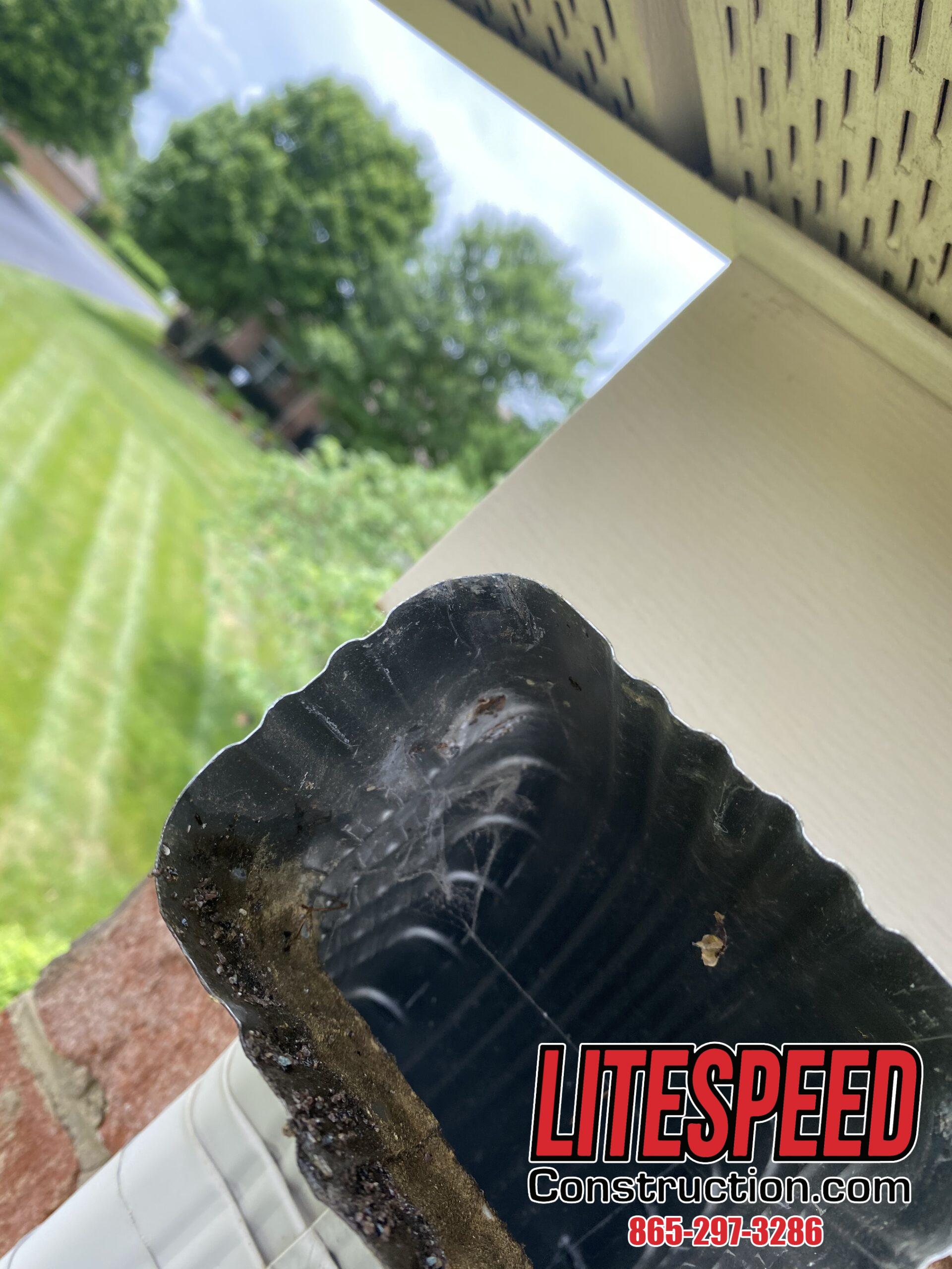 This is a picture of a downspout elbow that has been cleared