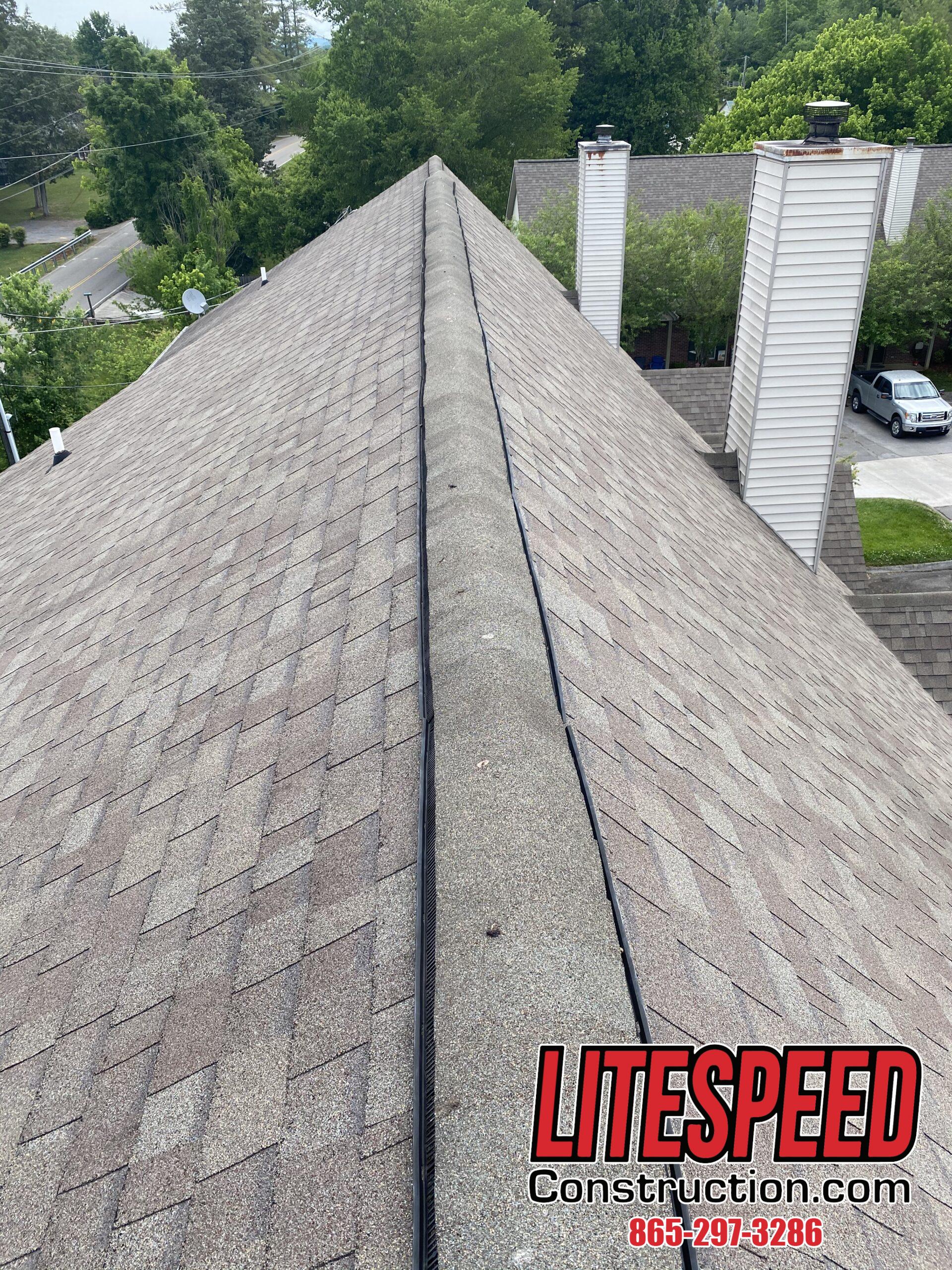 This is a picture of a ridge vent with ridge cap shingles
