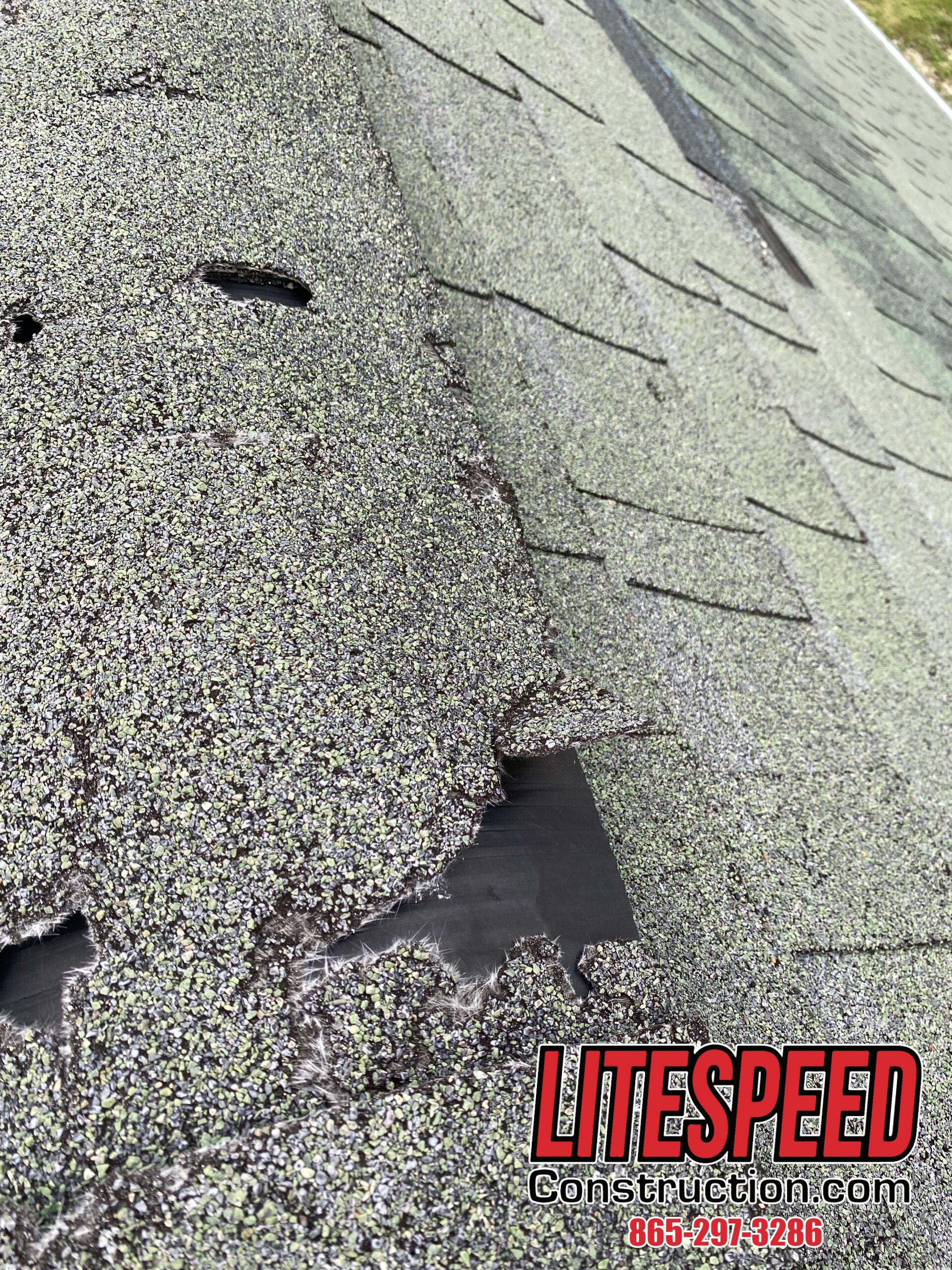 This is a picture of a green ridge cap shingle that is broken