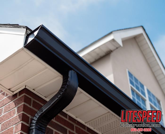 This is a picture of gutters with new 6 inch bronze gutters