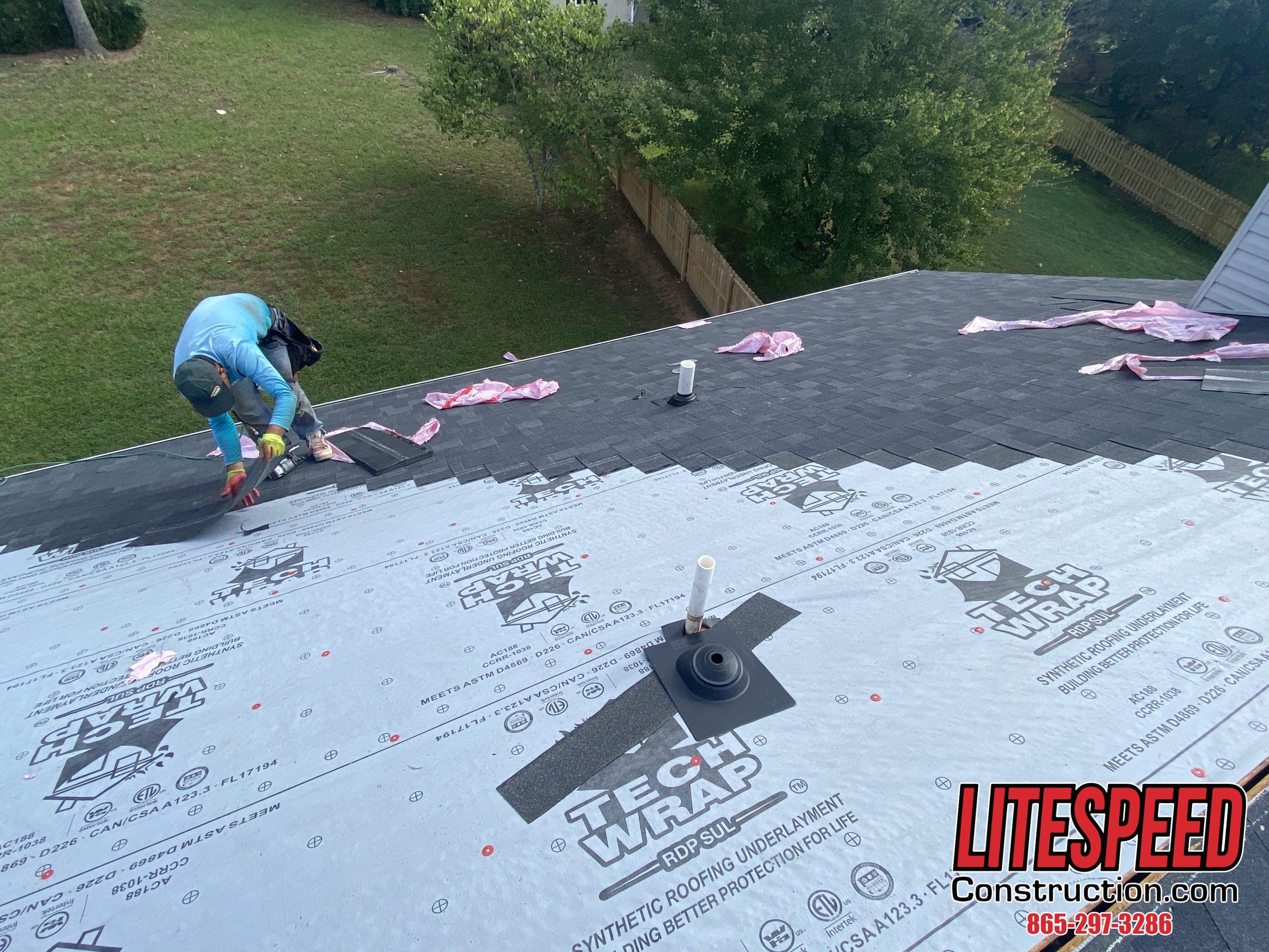 this is a picture of synthetic underlayment  under new shingles