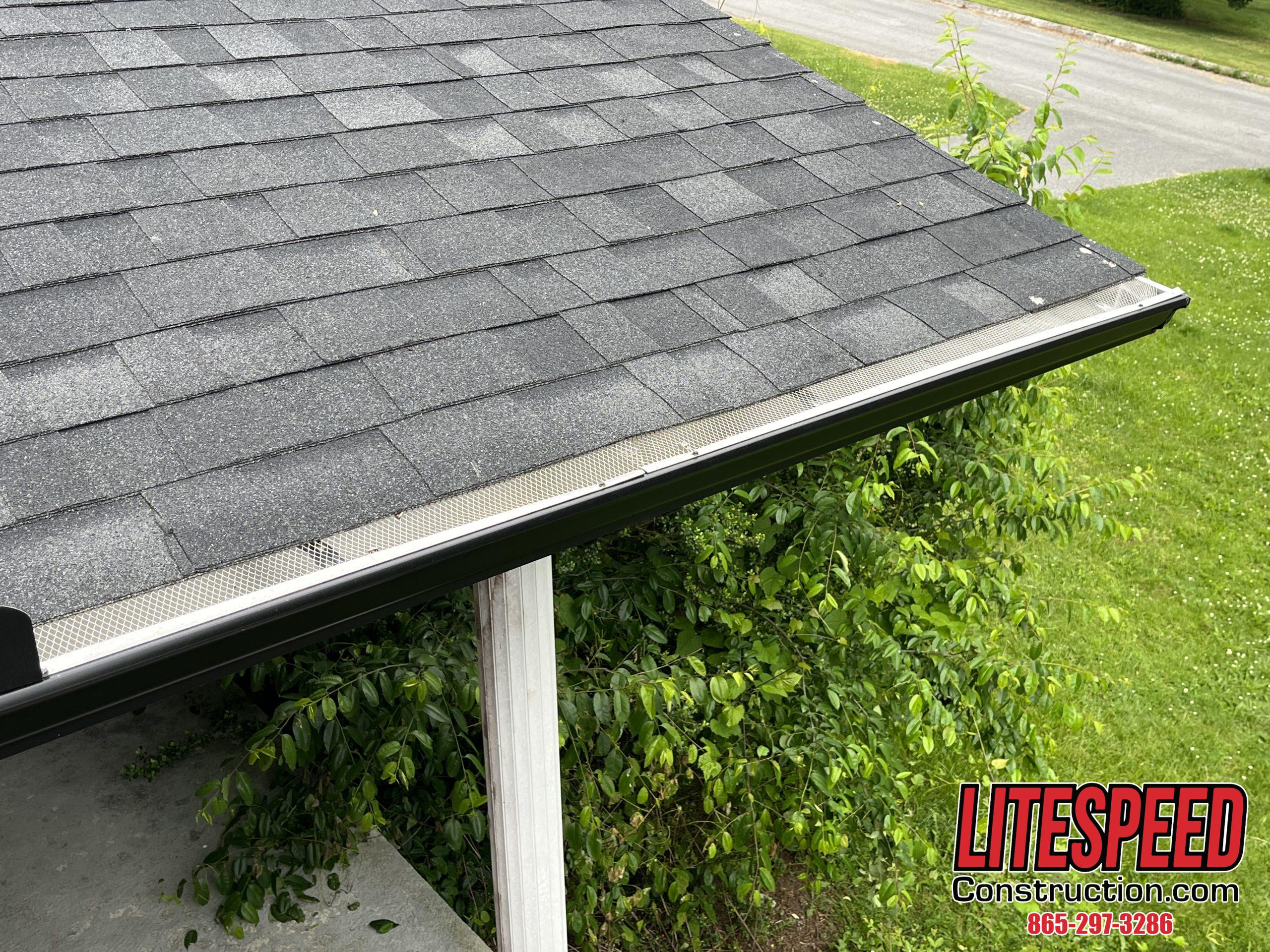 This is a picture of new black five inch gutters 