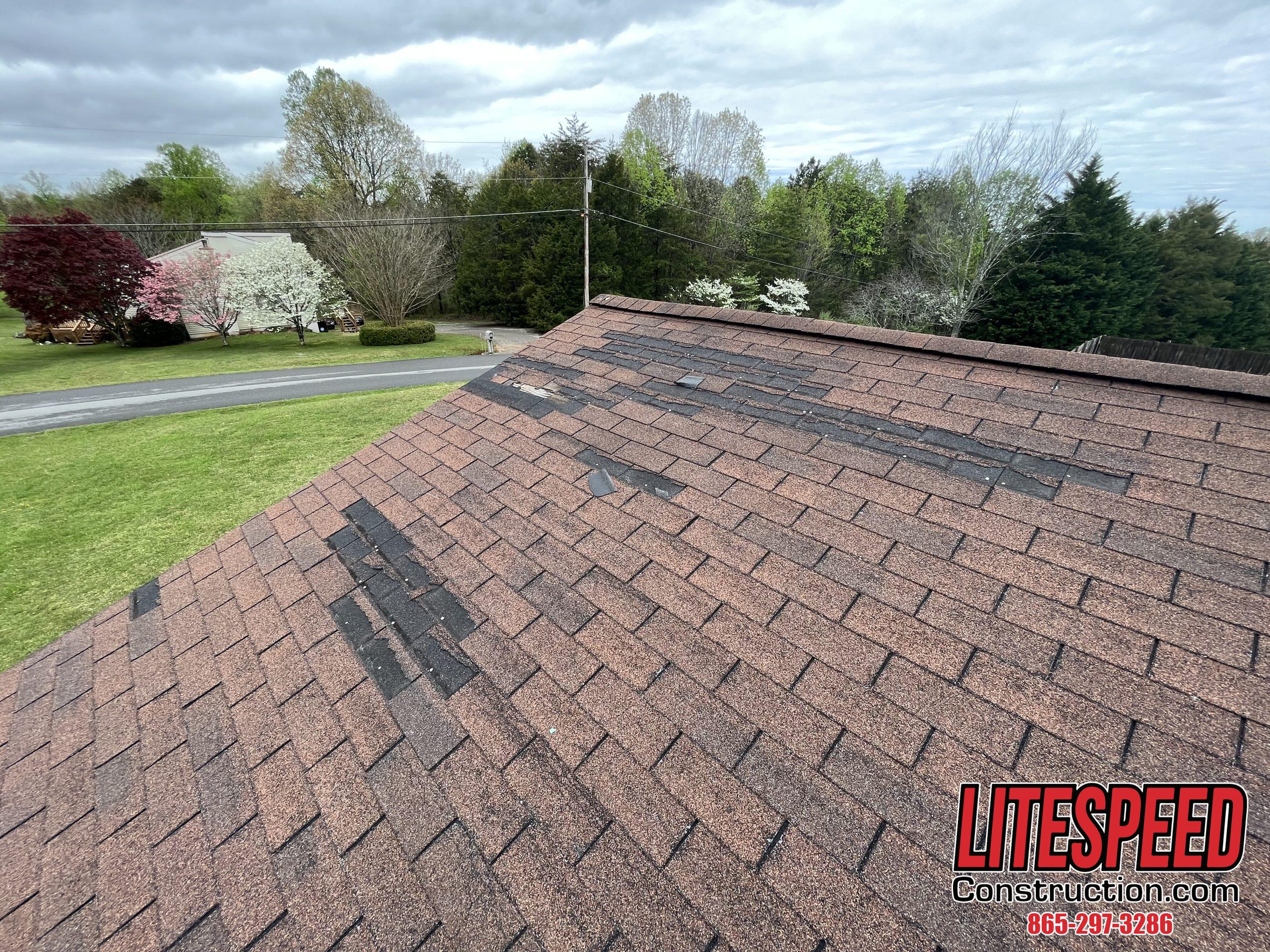 This is a picture of a hickory three tab roof with missing tabs