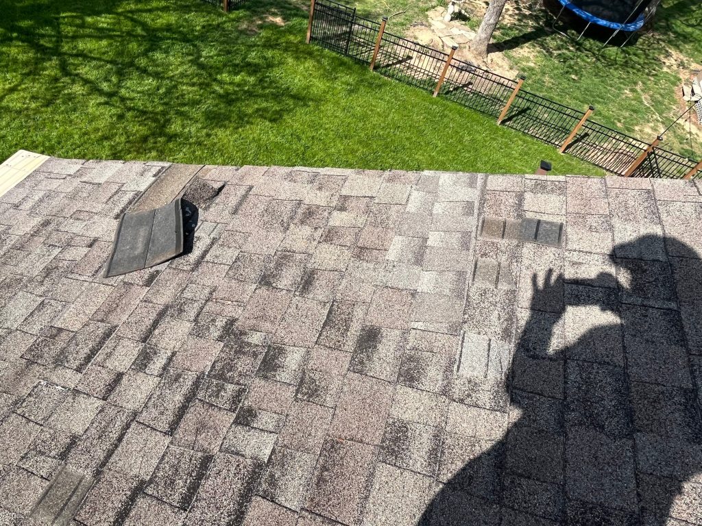 Lifted layer of shingles