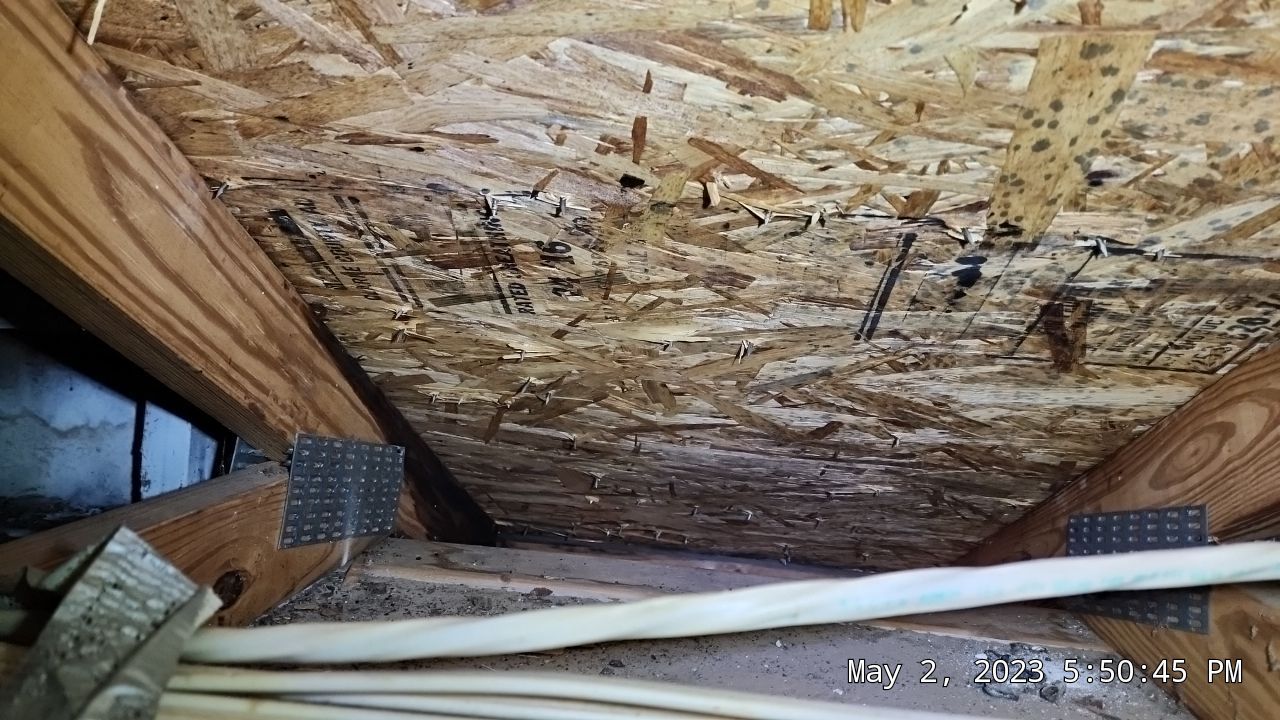 Water damage and rotting boards in attic space