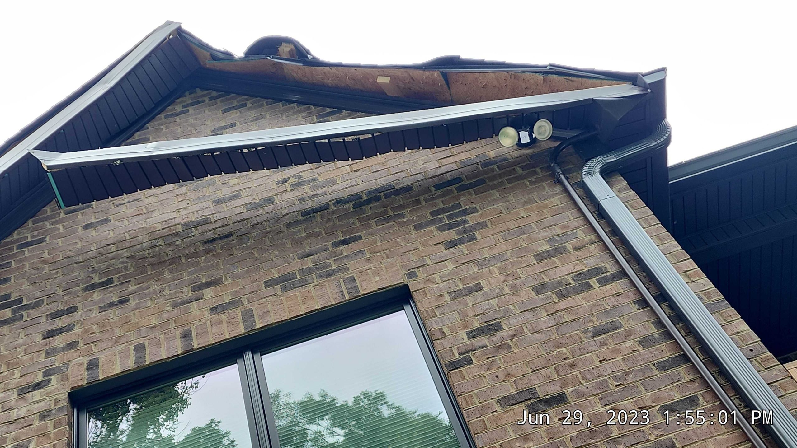 Broken, detached fascia and soffit exposing boards.