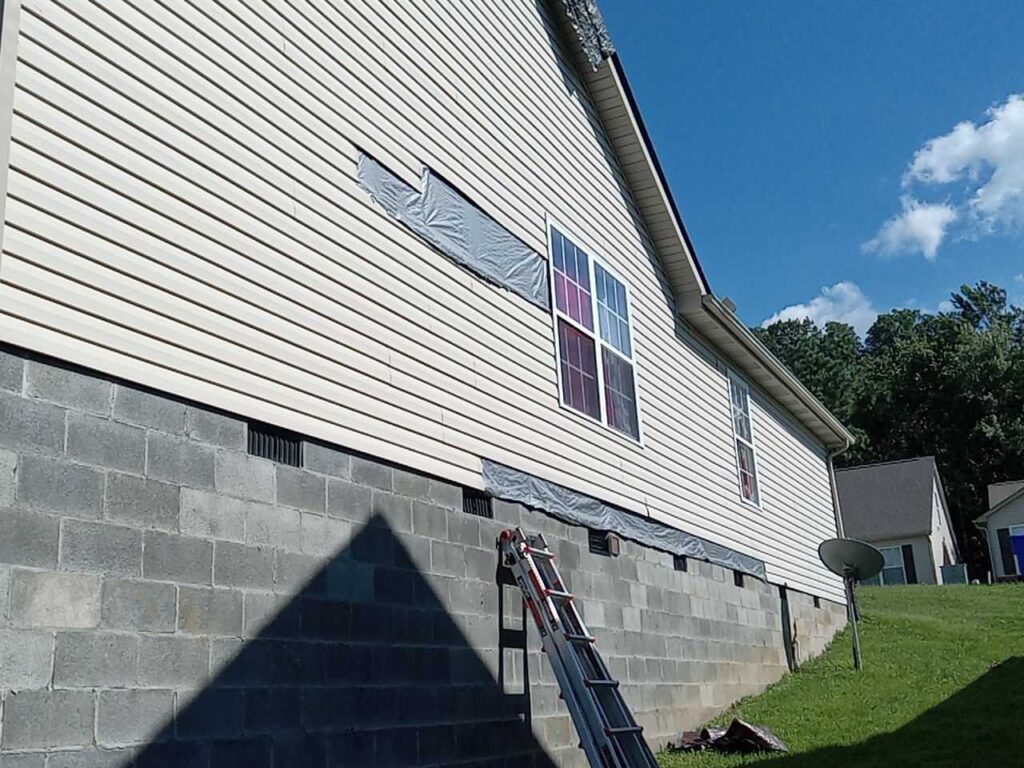 Missing siding and fascia board