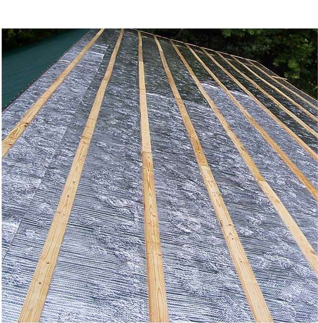 Photo showing radiant barrier installed on a roof.