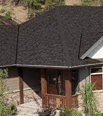 Should I use builder's grade shingles when re-roofing my home?